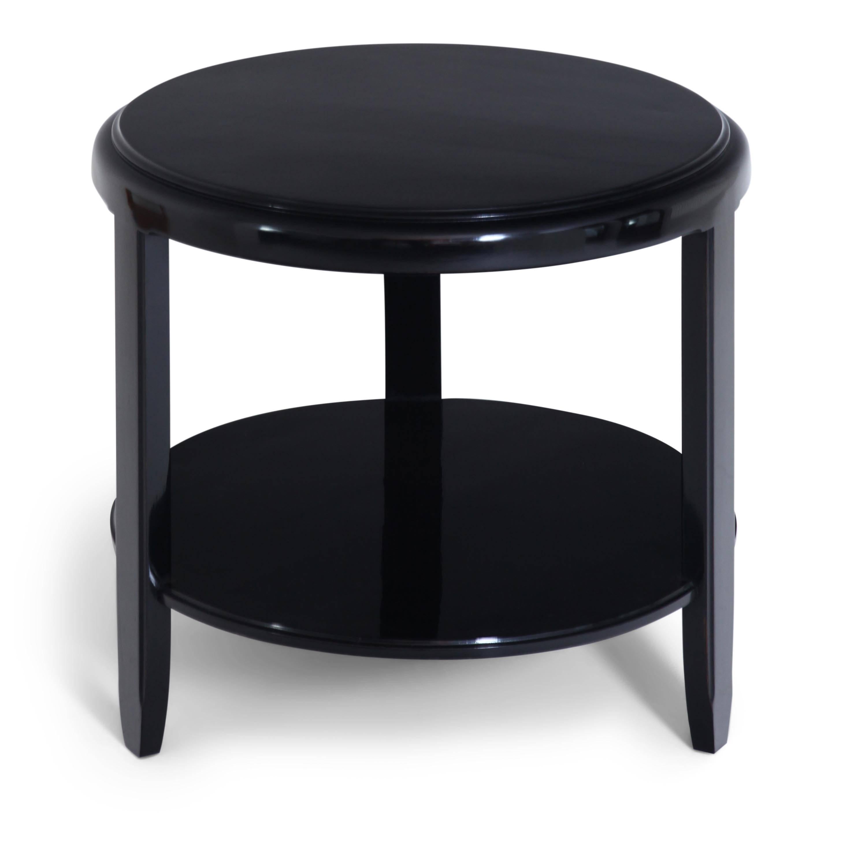 Three-legged ebonized Art Deco side table by Louis Majorelle (1859-1926). The round table is stamped at the bottom. The table was later ebonized.
