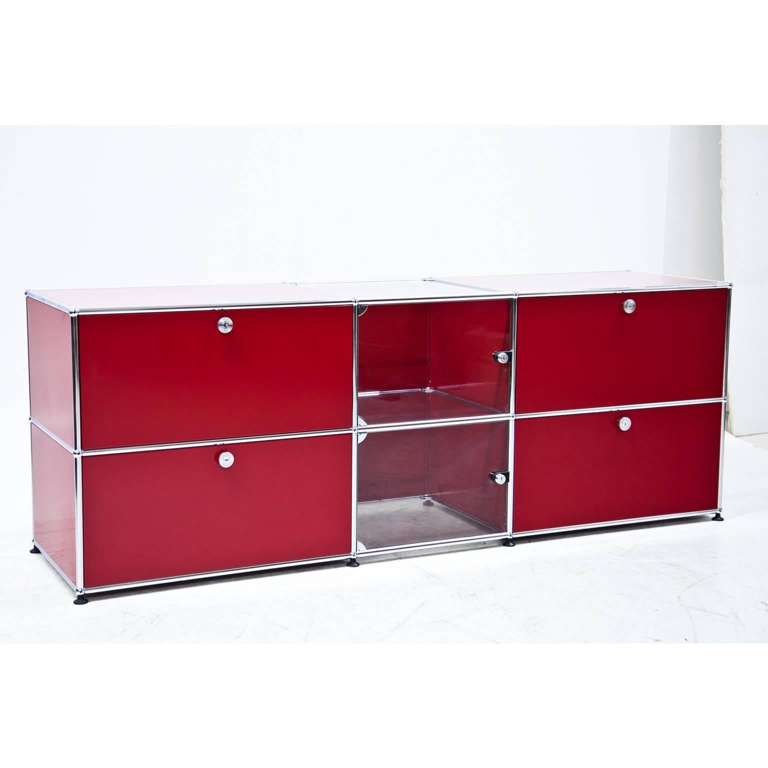 Red Usm Haller sideboard with two compartments for files, two-fold-down compartments and a display case element in the centre.
