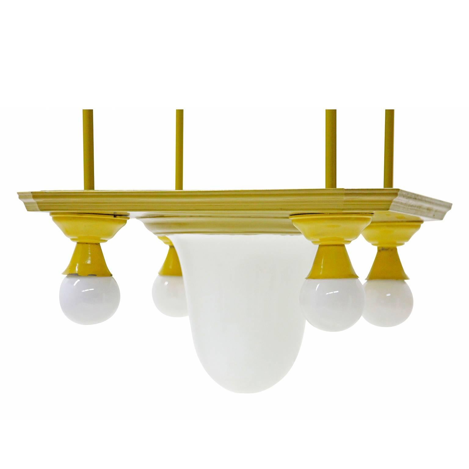 Unusual Ceiling Lamp from Germany, circa 1905. Five Opaque white glass bulbs are dropped from four yellow thin rods that are attached to an octagonal ceiling cover with a round ceiling rosette element in its center. The central light is shaped like