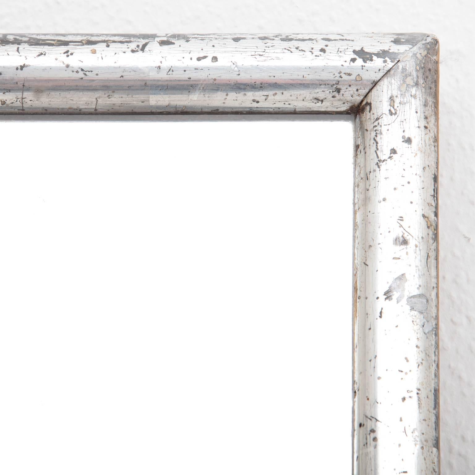 Large 20th century wall mirror. Frame with a silver patina.