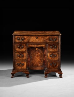 A George II Fiddleback Walnut Kneehole Desk