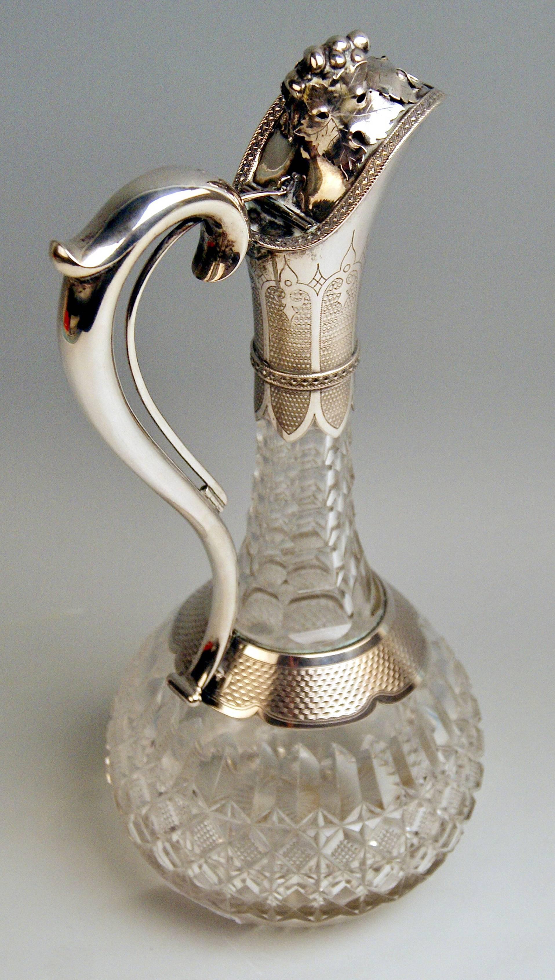 Glass decanter (wine carafe) with silver mountings
Art Nouveau
Hallmarked:
-- SILVER 800 MARK = SHAPED AS TOWER (= as it was used in POLAND or HUNGARY)
-- master's mark existing: BG (?) / a bit rubbed

made circa 1900 

Specifications:
The