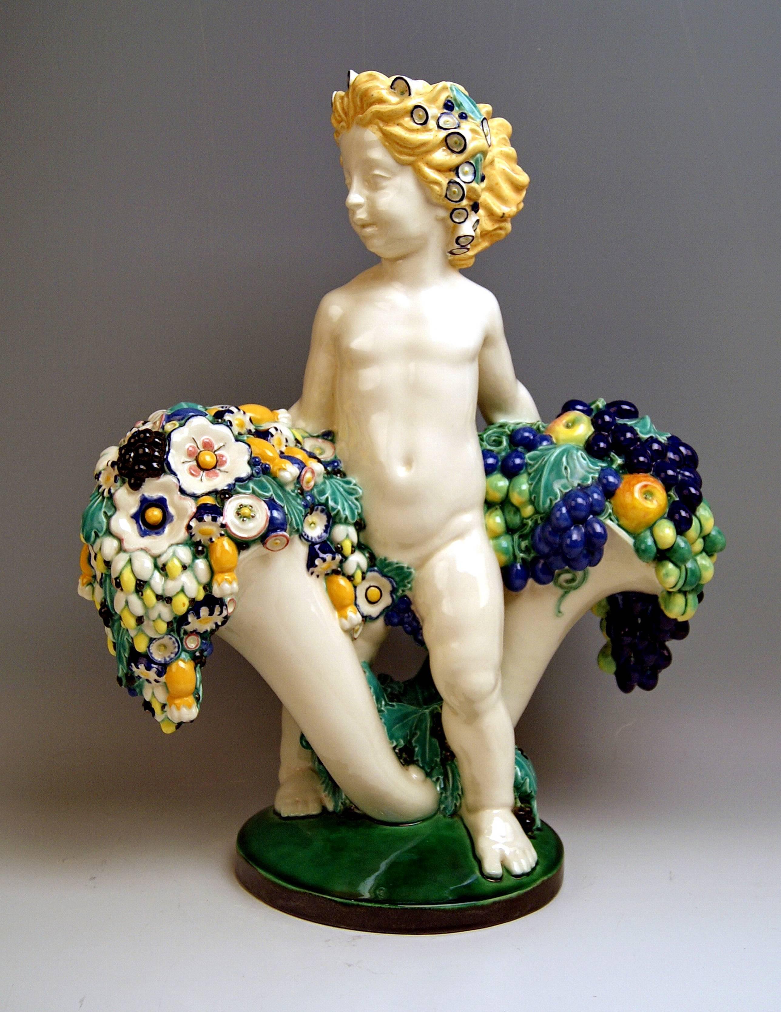 Bertold Löffler Tall Art Nouveau Sculpture: Cherub holding a pair of cornucopias / horns of plenty 

Modelled by Bertold Löffler (1874 - 1960), c. 1912.

Hallmarked:
Manufactured by Wiener and Gmundner Keramik (= Union of Viennese and Gmunden