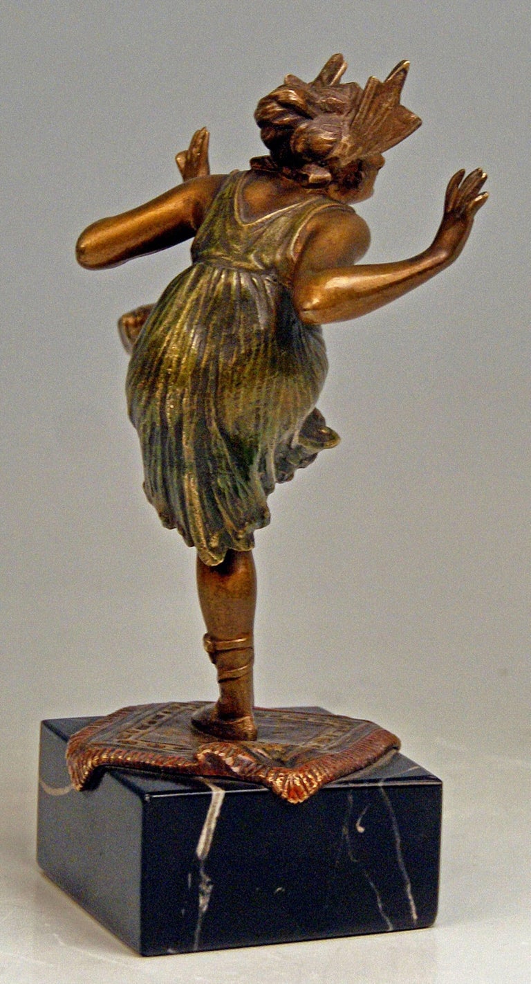 Interesting Vienna Bronze Figurine: Dancing Lady
 
It is a finest figurine - it is a Viennese bronze item. 
The lady dancer standing on square carpet balances on her left leg whereas right leg is raised. She is clad in short dancing dress with