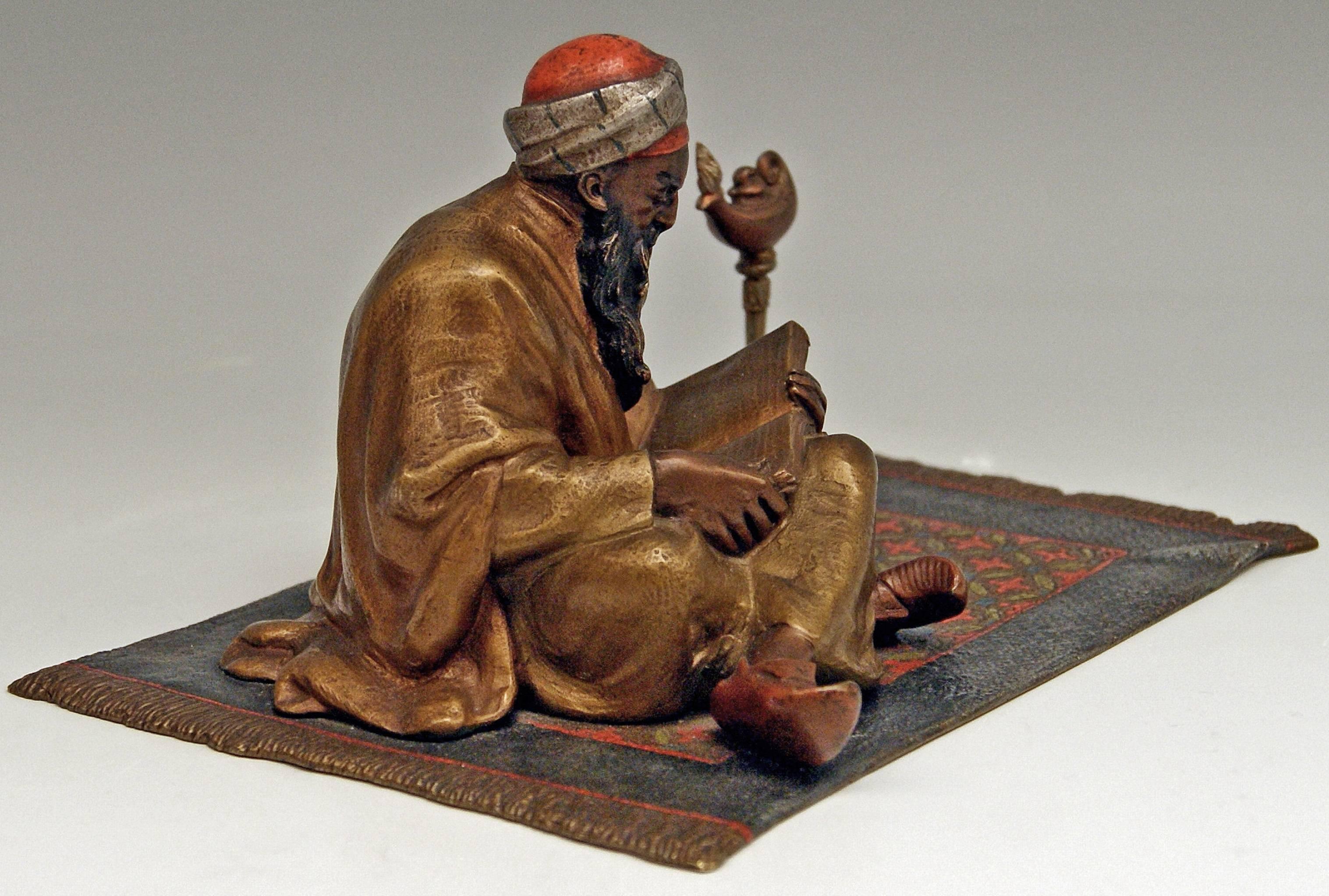 Stunning heavy bronze item: Arab man clad in long mantel situated on carpet 
(Please note: It is a quite large figurine !)

An Arab man wearing a turban is busy with reading a book: 
The old bearded man sits on carpet with crossed legs and holds