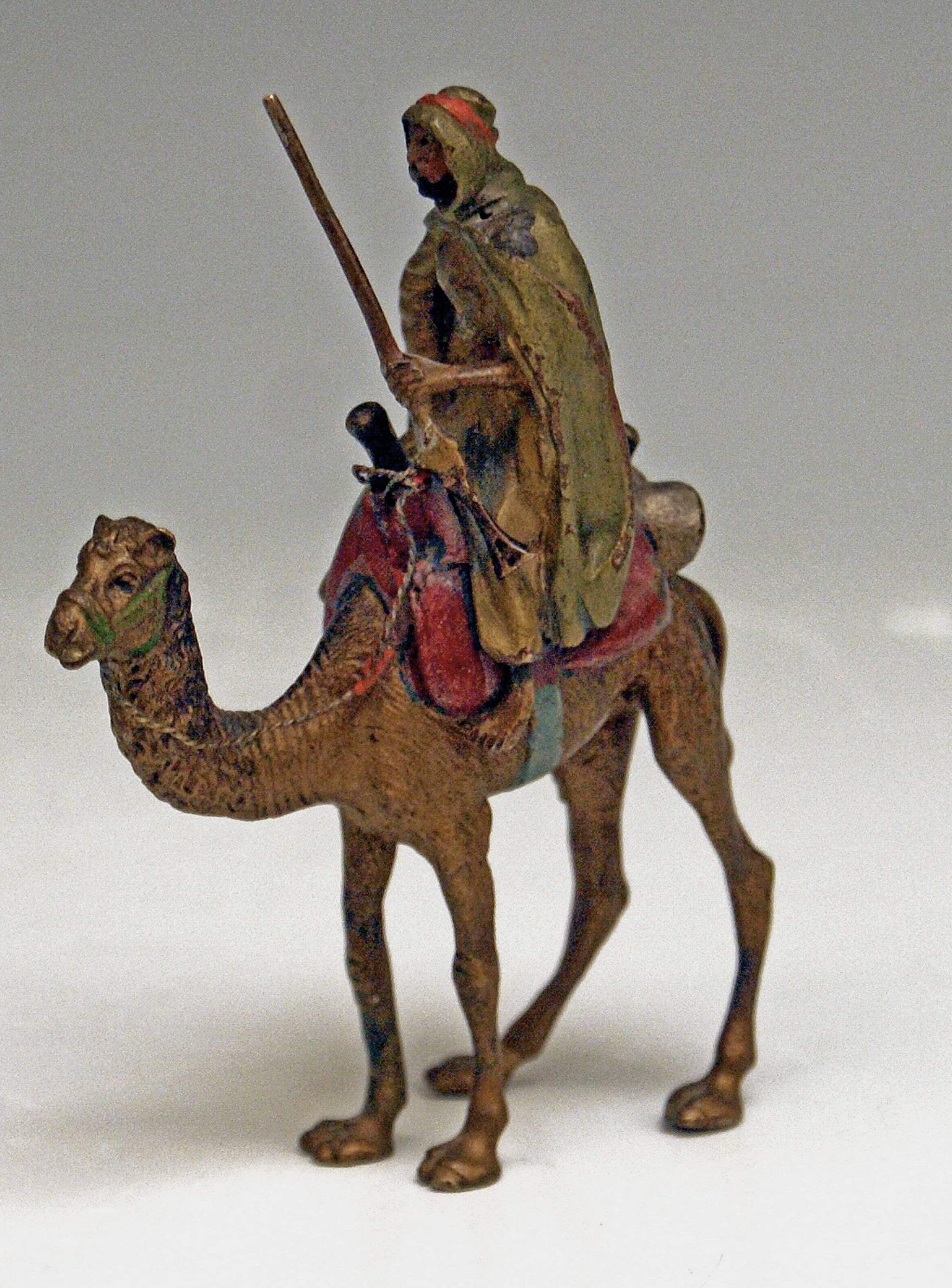 Stunning bronze figurine en miniature: Arab man clad in mantel riding on camel 

An Arab man holding a rifle rides on camel.
This bronze figurine en miniature is of Stunning Liveliness (finest manufacturing quality!). 
Signed at reverse side of