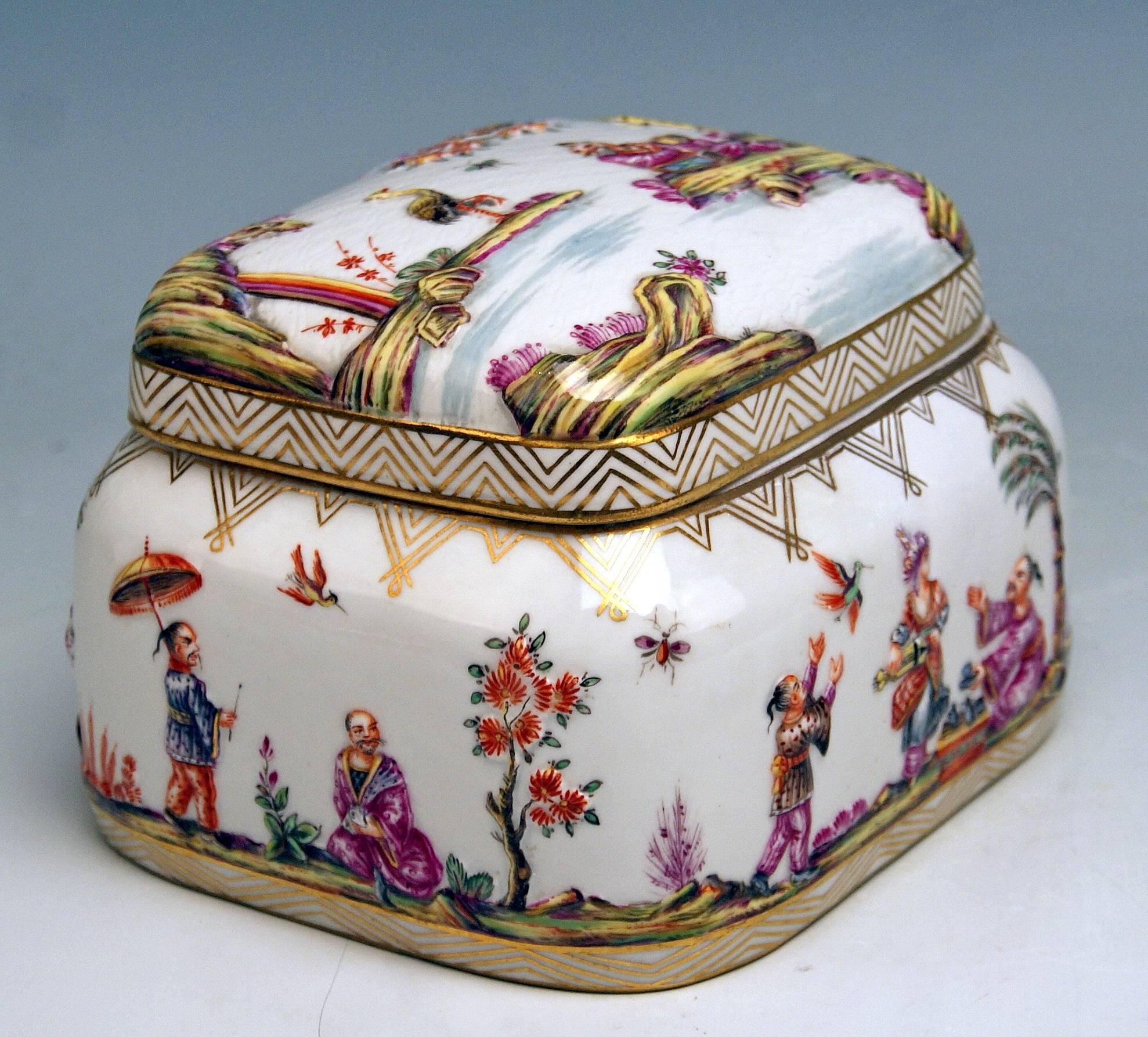 Meissen gorgeous lidded box with multicolored decorations (Chinoiseries) of relief type
 Measures:
height: 10.0 cm (3.93 inches) 
width: 14.0 cm (5.51 inches) 
depth: 11.5 cm (4.52 inches) 

Manufactory: Meissen
Hallmarked: Blue Meissen Sword