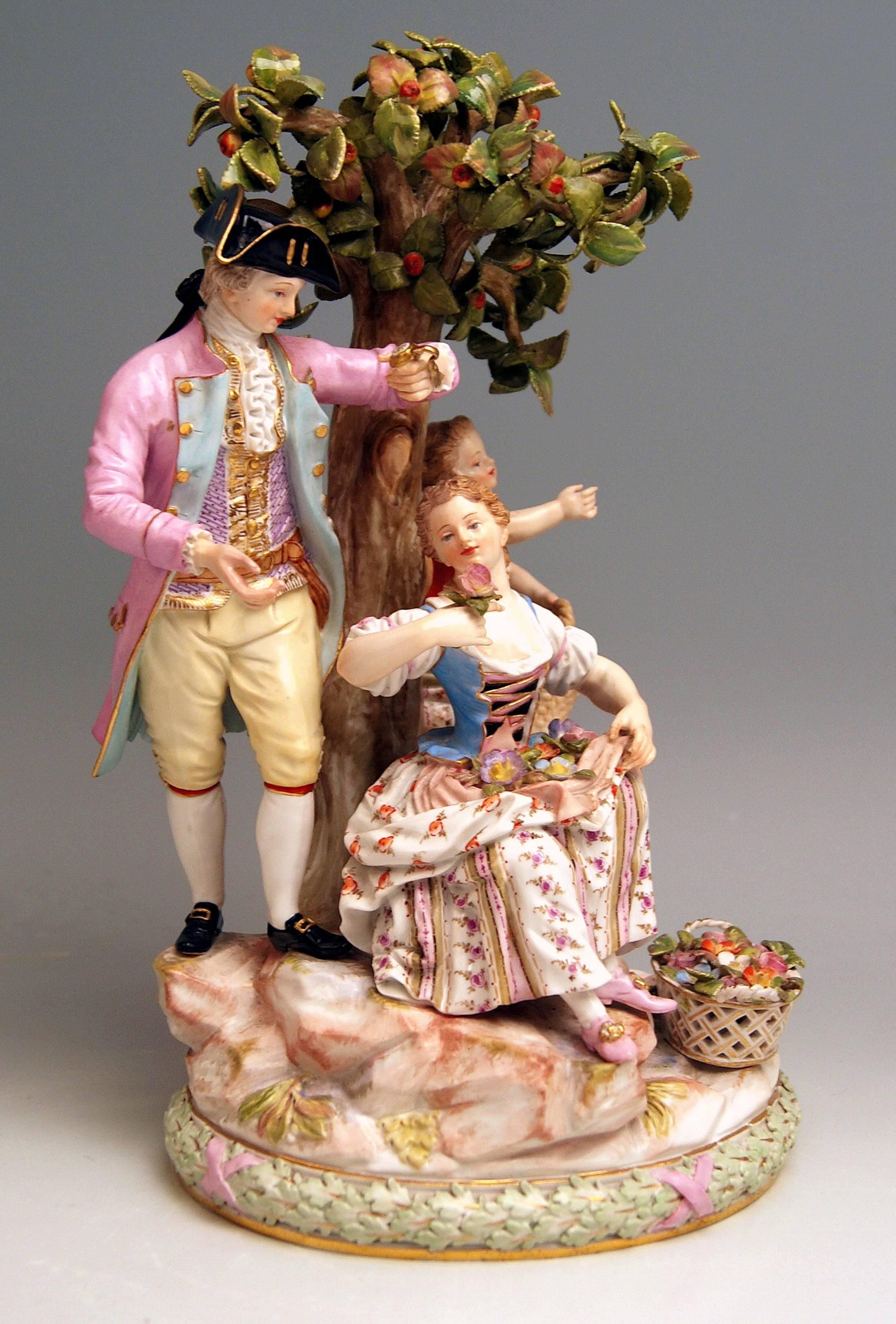 Meissen Figurine Group: The Apple Harvest 

Manufactory: Meissen
Hallmarked: Blue Meissen Sword Mark with Pommels on Hilts
Model Number D 94
Former's Number 48
Painter's Number 43
First quality
Dating: made circa 1870 
Material: porcelain,