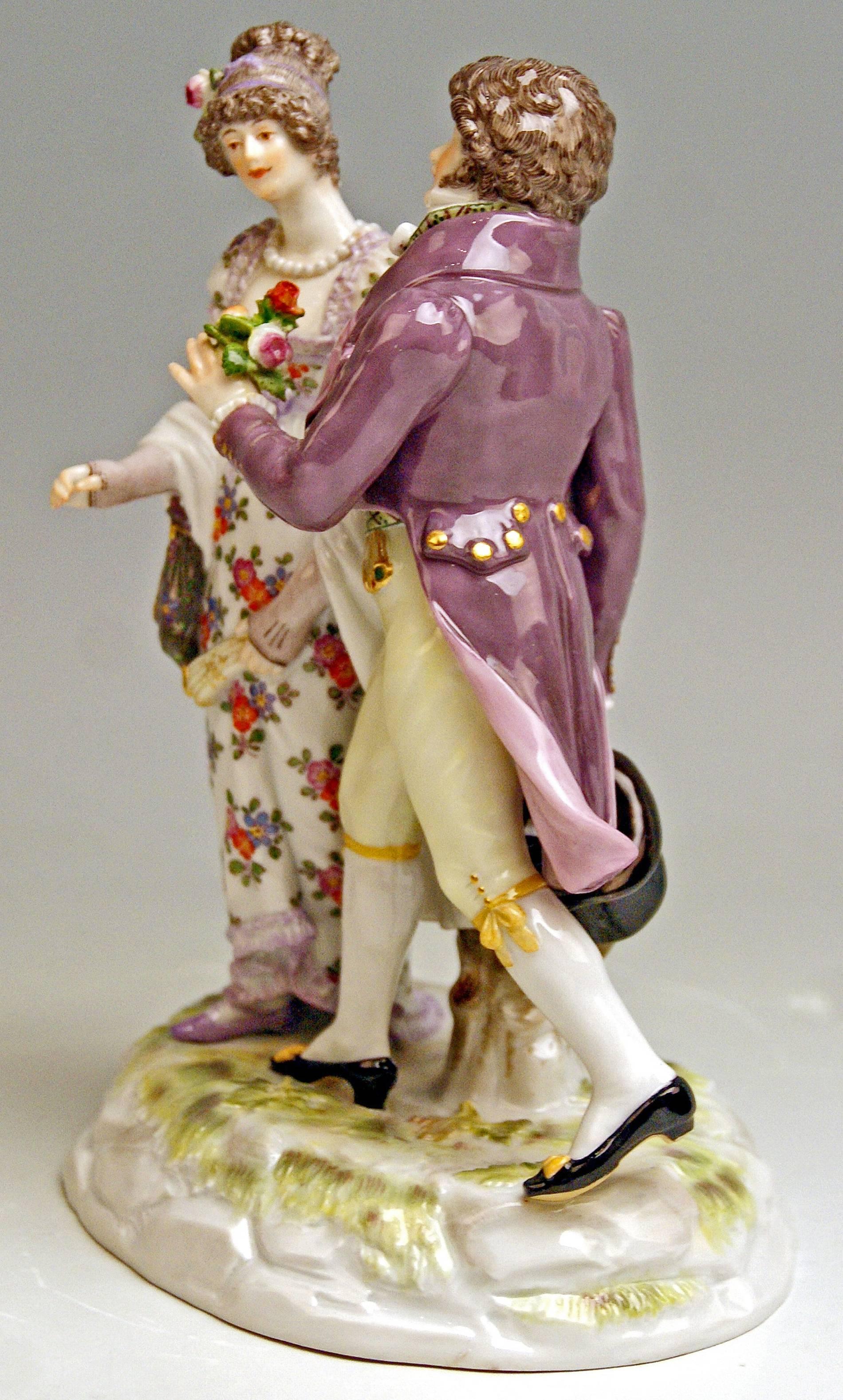 Meissen Figurine Group:  Gallant Couple Clad in Biedermeier Garments

Manufactory: Meissen
Hallmarked:  Blue Meissen Sword Mark with Pommels on Hilts
Model Number K 163
Former's Number  52
Painter's Number 37
FIRST QUALITY  
Dating:    made circa