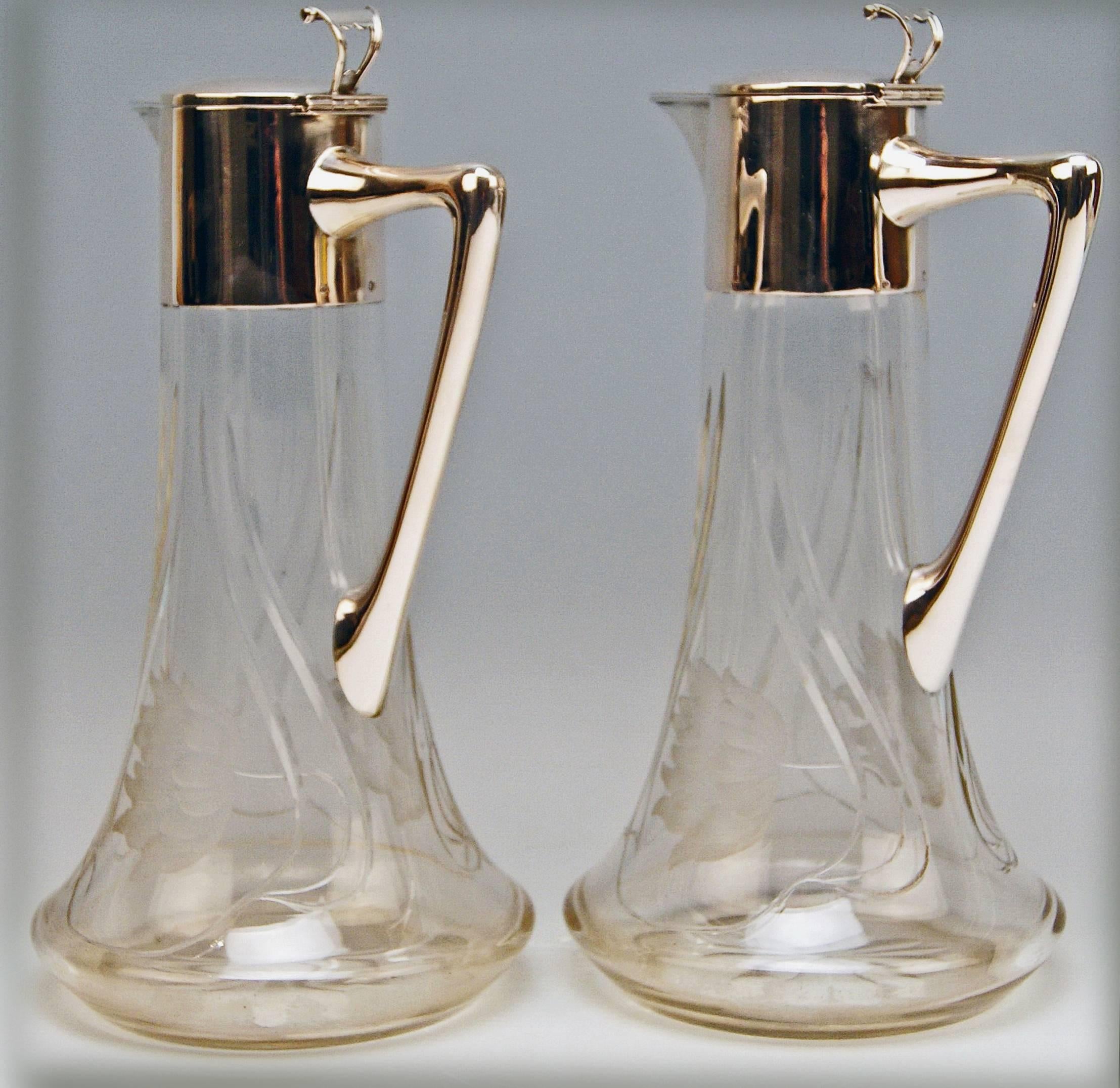 Excellent Pair of  Art Nouveau Glass Decanters  / Jugs,  made circa 1900

Manufactory:
Alexander Birkl / Vienna  (= mark of manufactory impressed)
Bibliography:
Waltraud Neuwirth,  Viennese Gold - and Silversmiths and Their Marks 1867 - 1922 ,