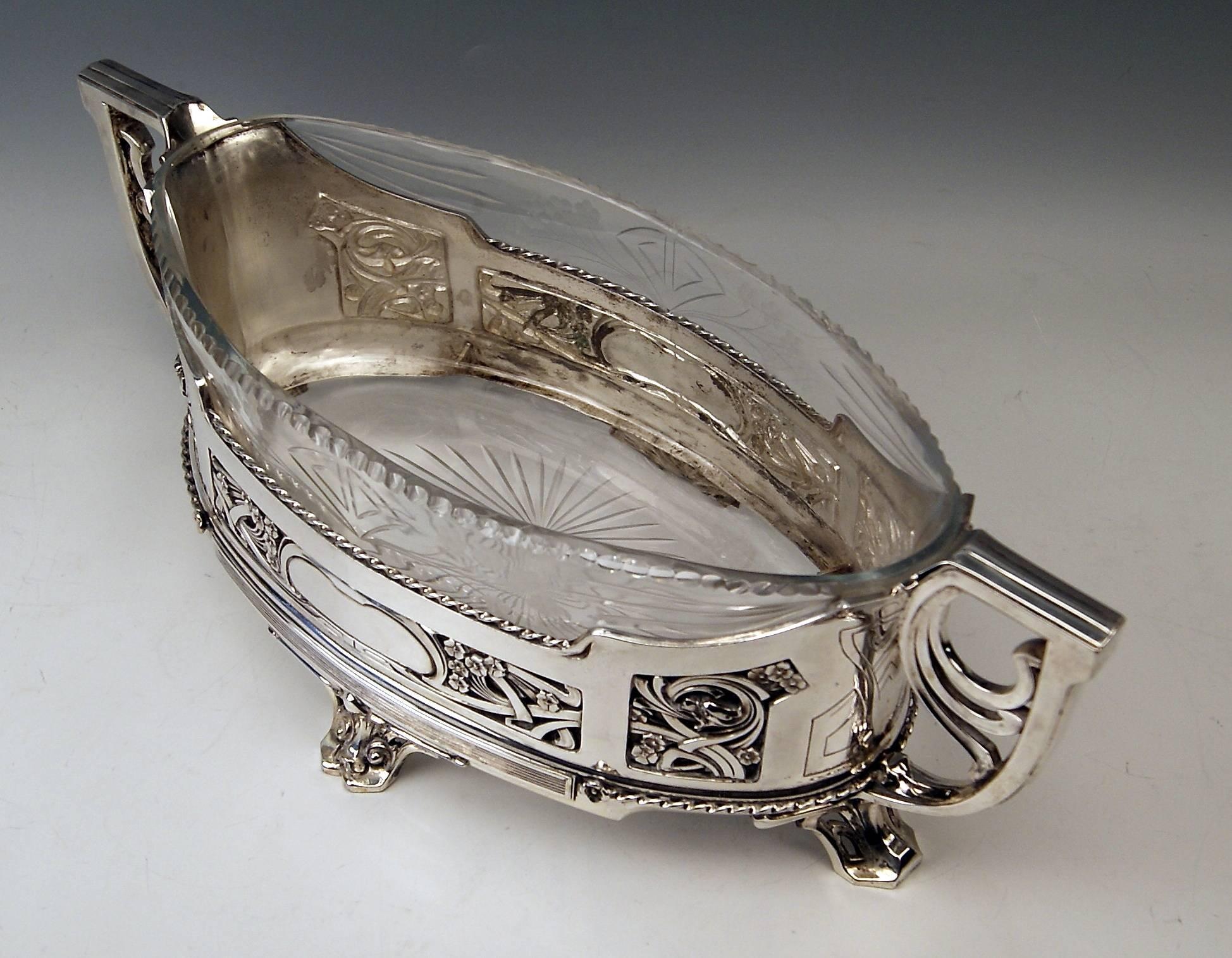 Silver German huge flower bowl / Centrepiece with Original Glass Liner.
Measure: Width: 51.5 cm ( = 20.27 inches).

Art Nouveau period (made circa 1900).
Silver 800
branded by German Crescent with Crown.
Manufactory: 
Hallmarked by Wilkens &