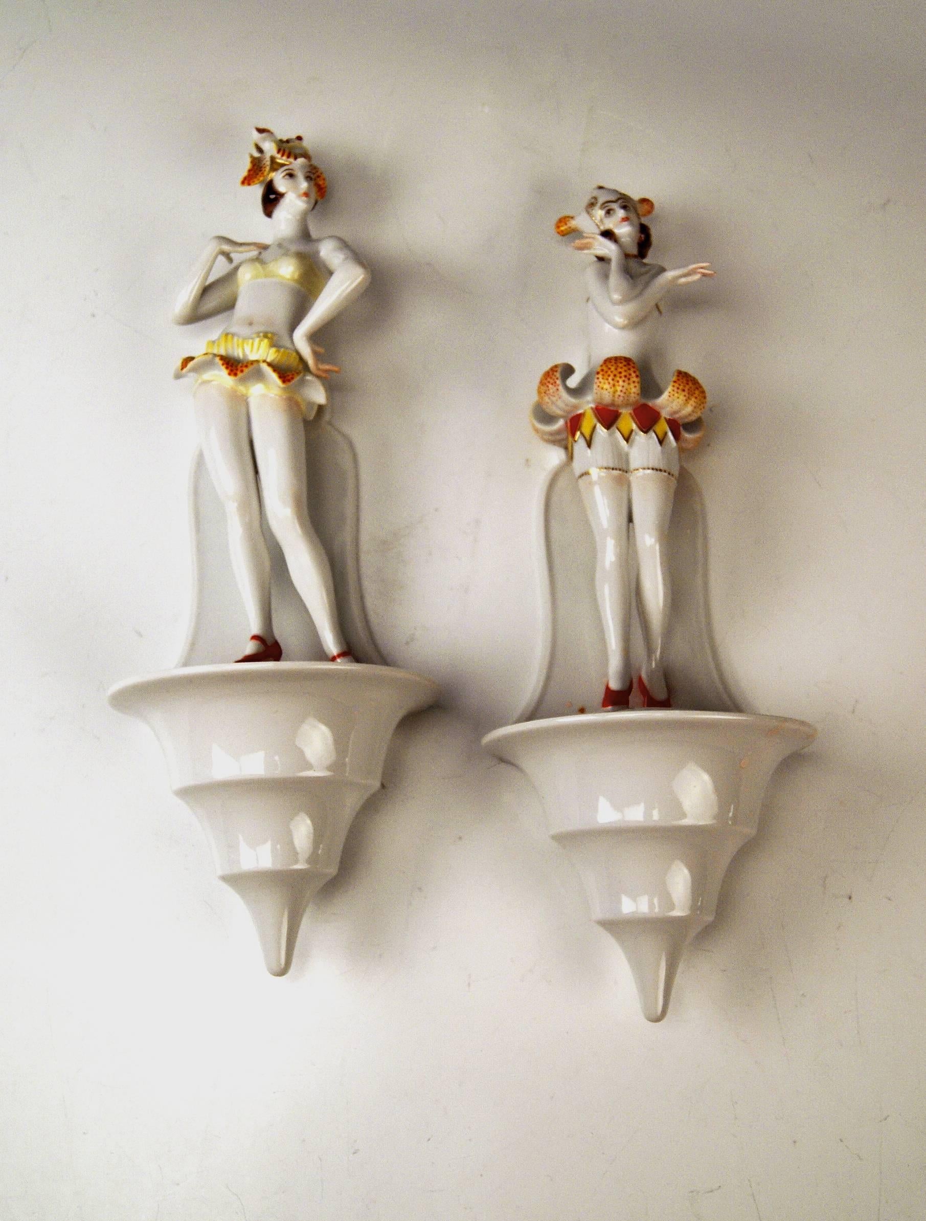 RAREST ROSENTHAL / GERMANY ITEMS:
A Pair of Art Deco Lotus Flowers on Wallmounted Flower Frog /
model created by Dorothea Charol in year 1929 at the Plössberg factory.

Very interesting, rarest Rosenthal Germany two female figurines having the