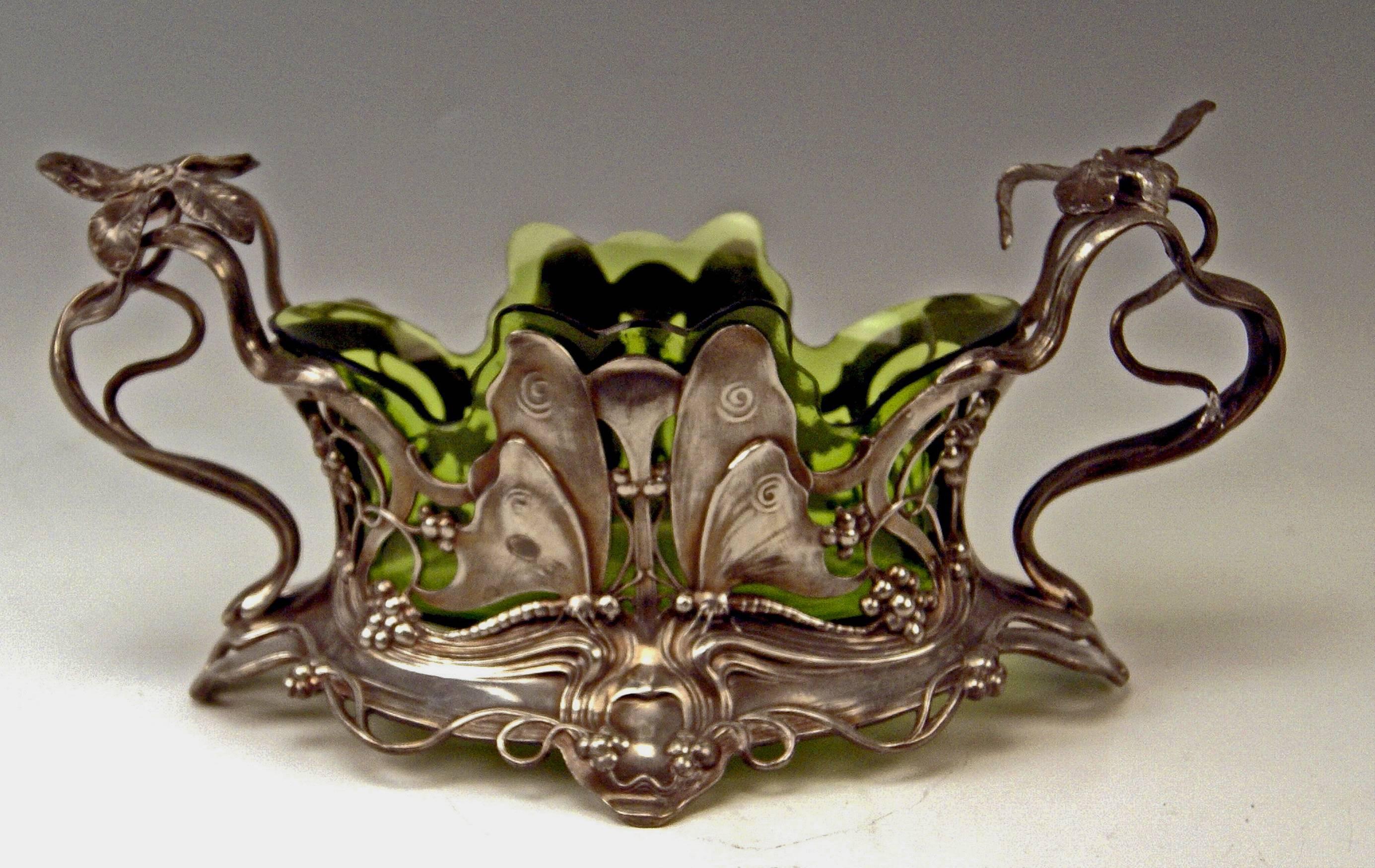 Superb WMF Art Nouveau flower dish/jardiniére (silver plated) with original glass liner.
The silver plated part of flower dish is decorated with most elegant Art Nouveau ornaments of floral type (bowl's wall is stunningly worked in reticulated
