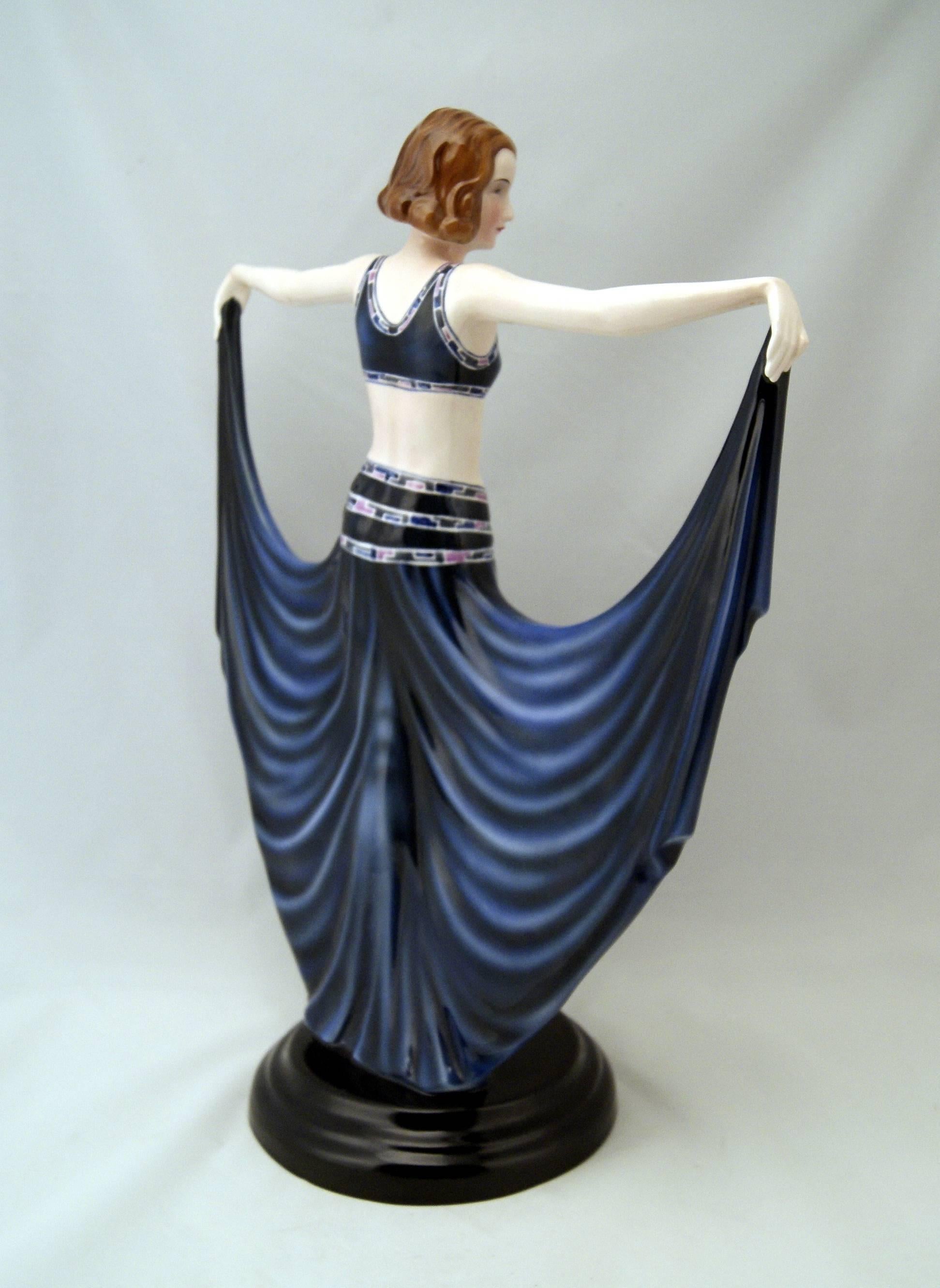 Goldscheider Vienna tall posed lady dancer wearing blue long skirt.

Designed by Josef Lorenzl (1892 - 1950) / one of the most important designers having been active for Goldscheider manufactory in period of 1920-1940 / Designed, circa