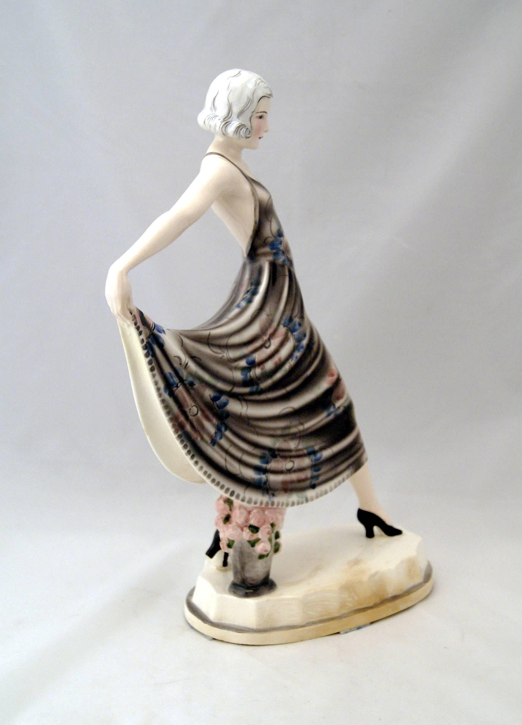 Goldscheider Vienna dancing lady wearing fine dancing dress with spaghetti straps, decorated with nicest flowers' pattern: This figurine shows the famous actress Lilian Harvey.

Designed by Stefan (= Stephen) Dakon (1904-1992), 
modelled, circa