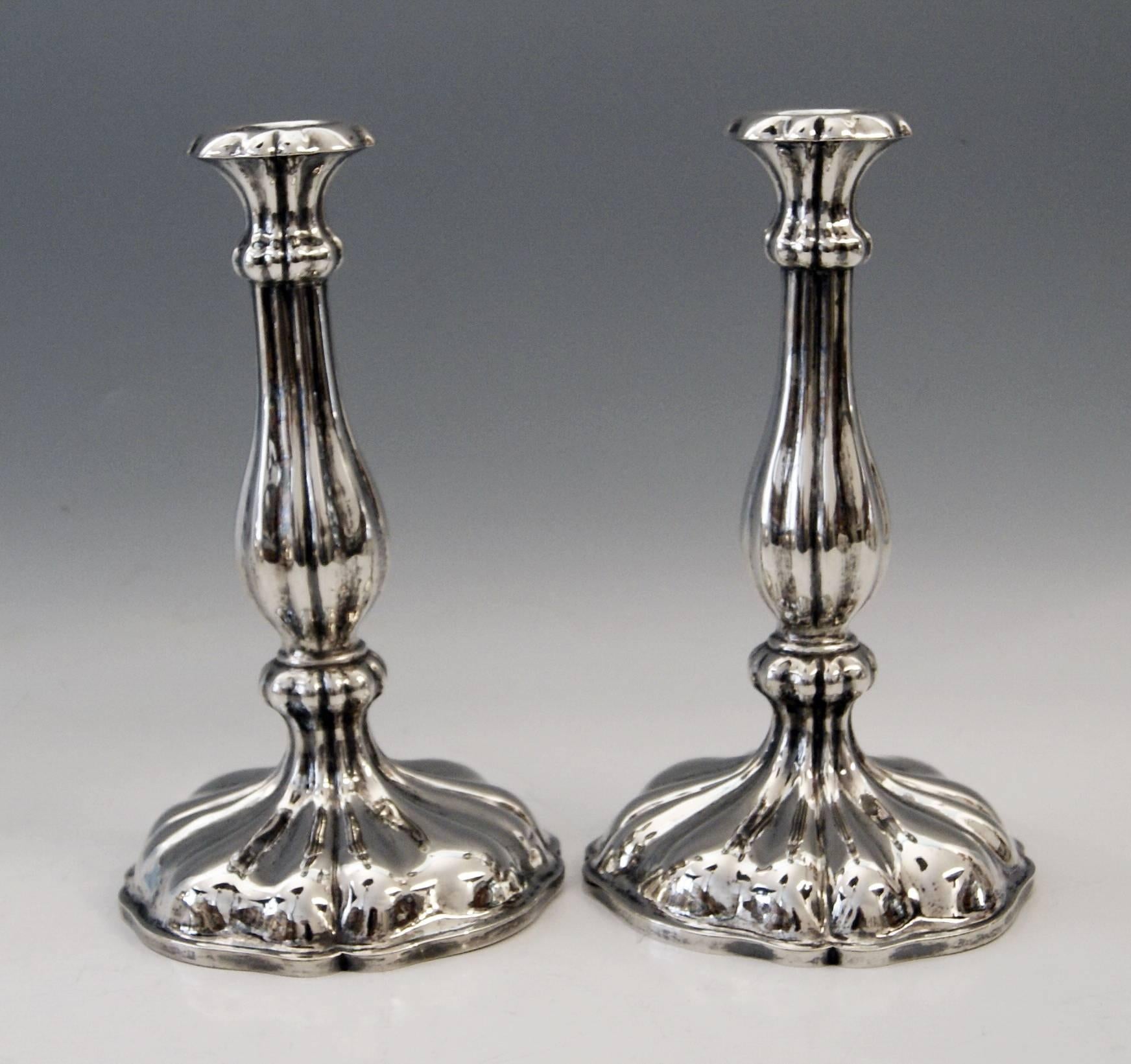 Austrian excellent Biedermeier silver pair of candlesticks,
made 1855.

Very interesting Viennese silver pair of candlesticks of excellent manufacturing quality as well as of elegant appearance.
These candlesticks were made during Viennese late