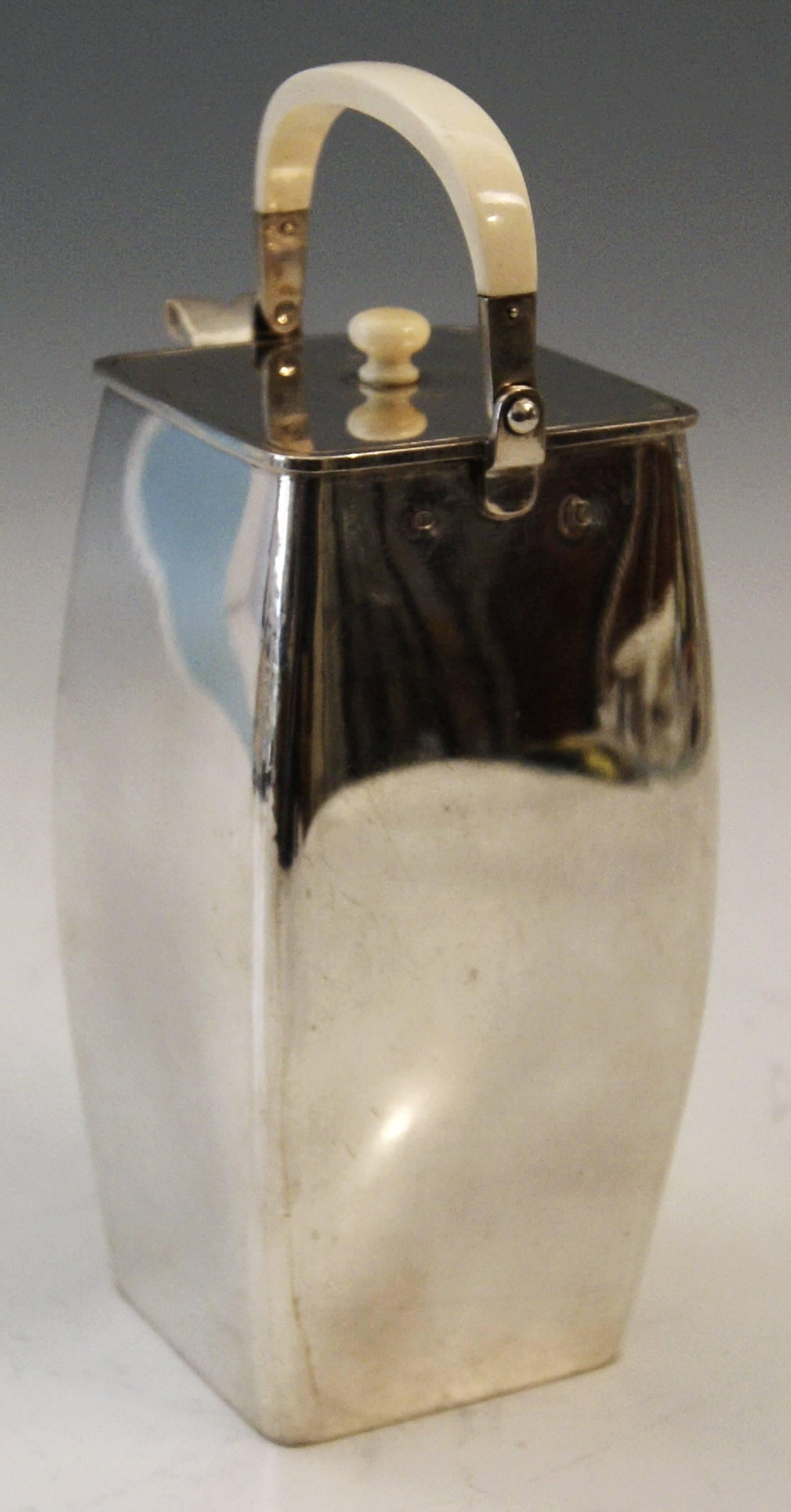 Silver most elegant chocolate pot with handle made of bone.
Art Nouveau Period made circa 1910.

Excellently made silver pot of finest quality.

The pot's form type is that of a tapering rectangular cuboid having been turned:
This most elegant