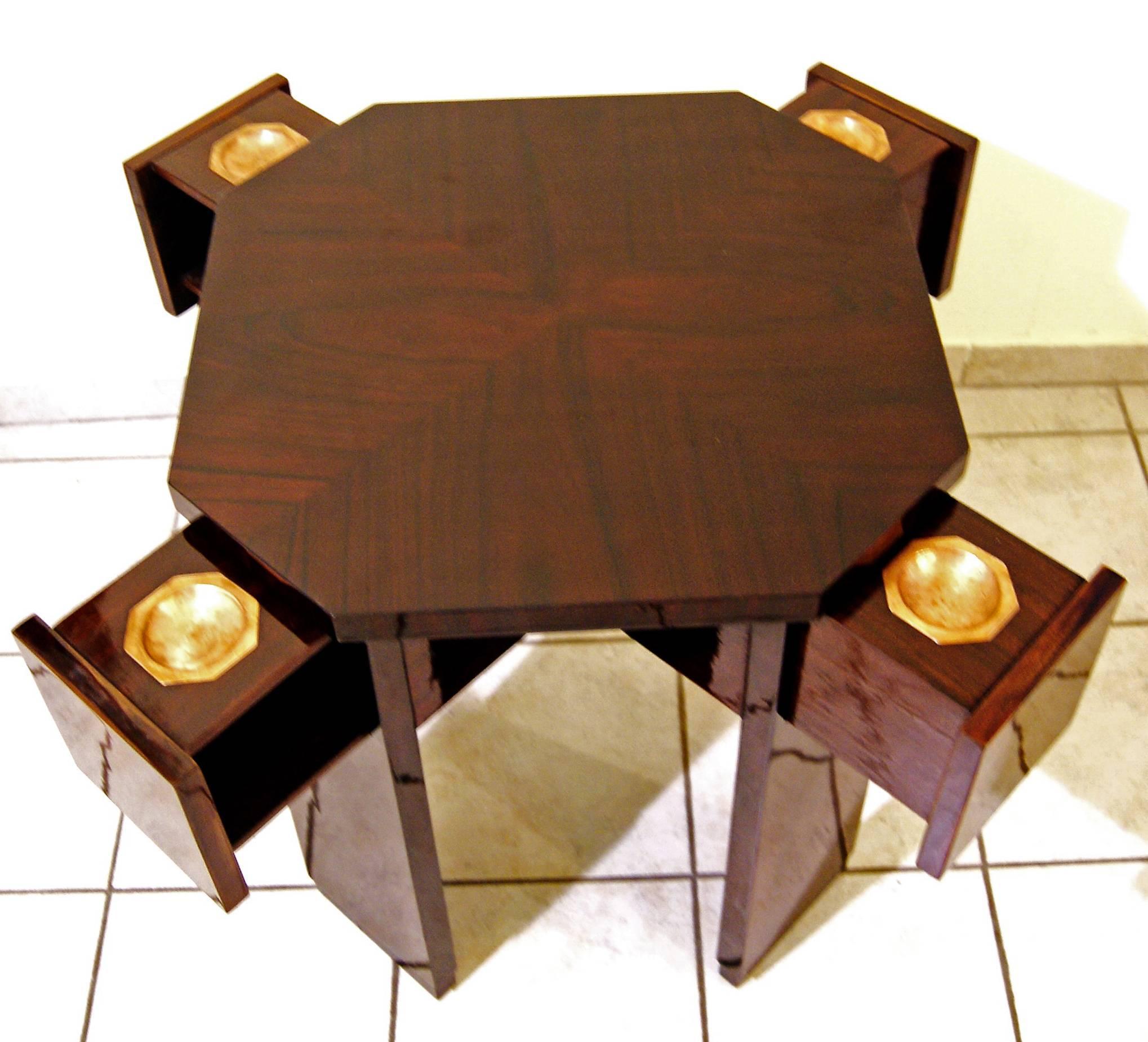 Art Nouveau game table (vintage),
Vienna, made circa 1900.
 
Rosewood veneer / refurbished by hand / copper fittings existing.
The table's plate is of octagonal form type / additionally, there are four drawers attached to edged areas, holding