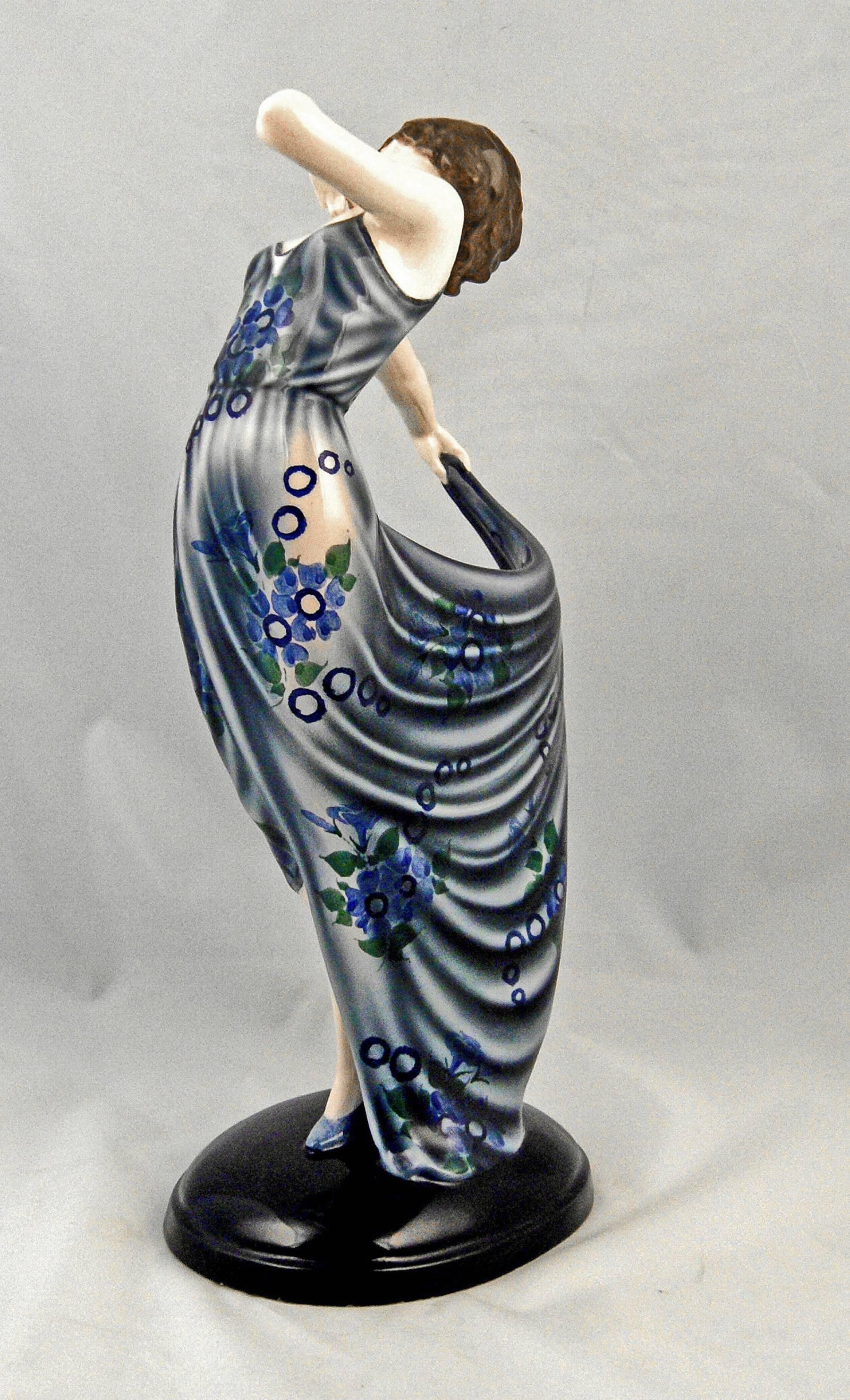 Goldscheider Vienna dancing lady wearing elegant dress.

Designed by Josef Lorenzl (1892-1950)/ one of the most important designers having been active for Goldscheider manufactory in period of 1920-1940. designed circa 1931-1932  /  made circa