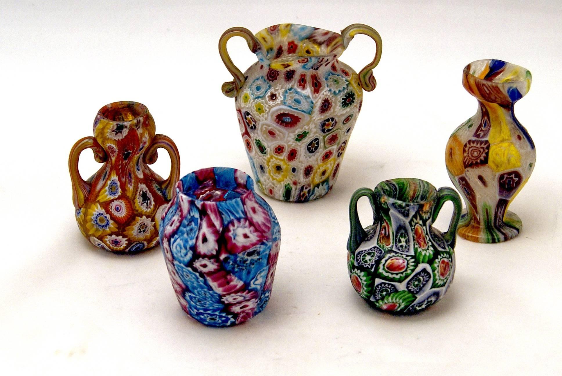 Set of five Murano vintage nice glass vases Millefiori, circa 1910.

Origin of Manufactory: Murano (manufactory Fratelli Toso)/ Venice, Italy.

Dating: circa 1910.

Type: Millefiori pattern.
There are various flowers of multicoloured type