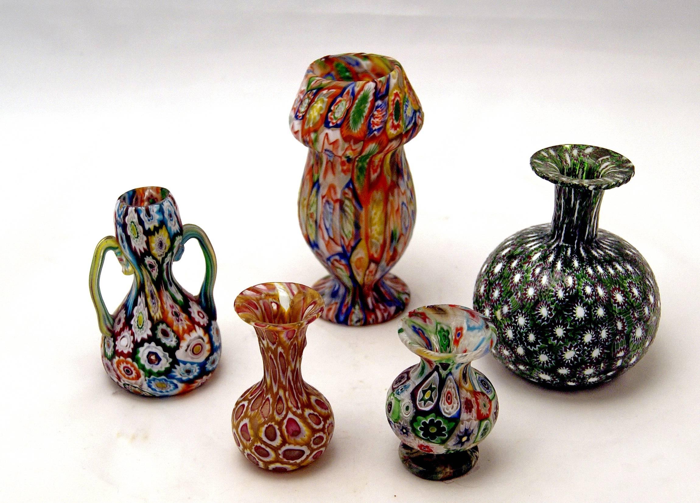 Set of five Murano vintage nice glass vases Millefiori, circa 1910.

Origin of manufactory: Murano (Manufactory Fratelli Toso) / Venice, Italy. 

Dating: circa 1910.

Type: Millefiori pattern. 
There are various flowers of multicoloured type