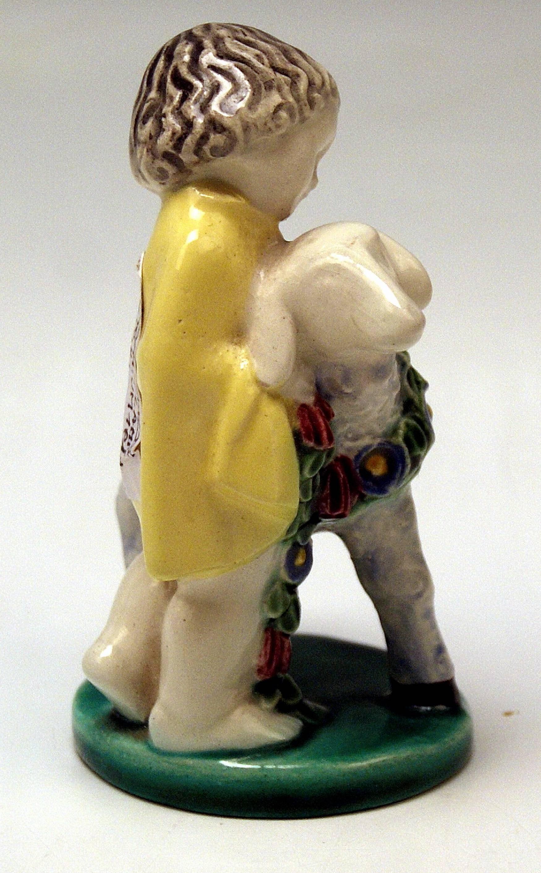 Michael Powolny Art Nouveau Child with Lamb.
Most lovely ceramics item !
Modelled by Michael Powolny (1871-1954), before 1910.

Hallmarked:
Manufactured by Wiener Keramik (Vienna Ceramics) & Gmunden Ceramics (WK & GK / hallmarked) //