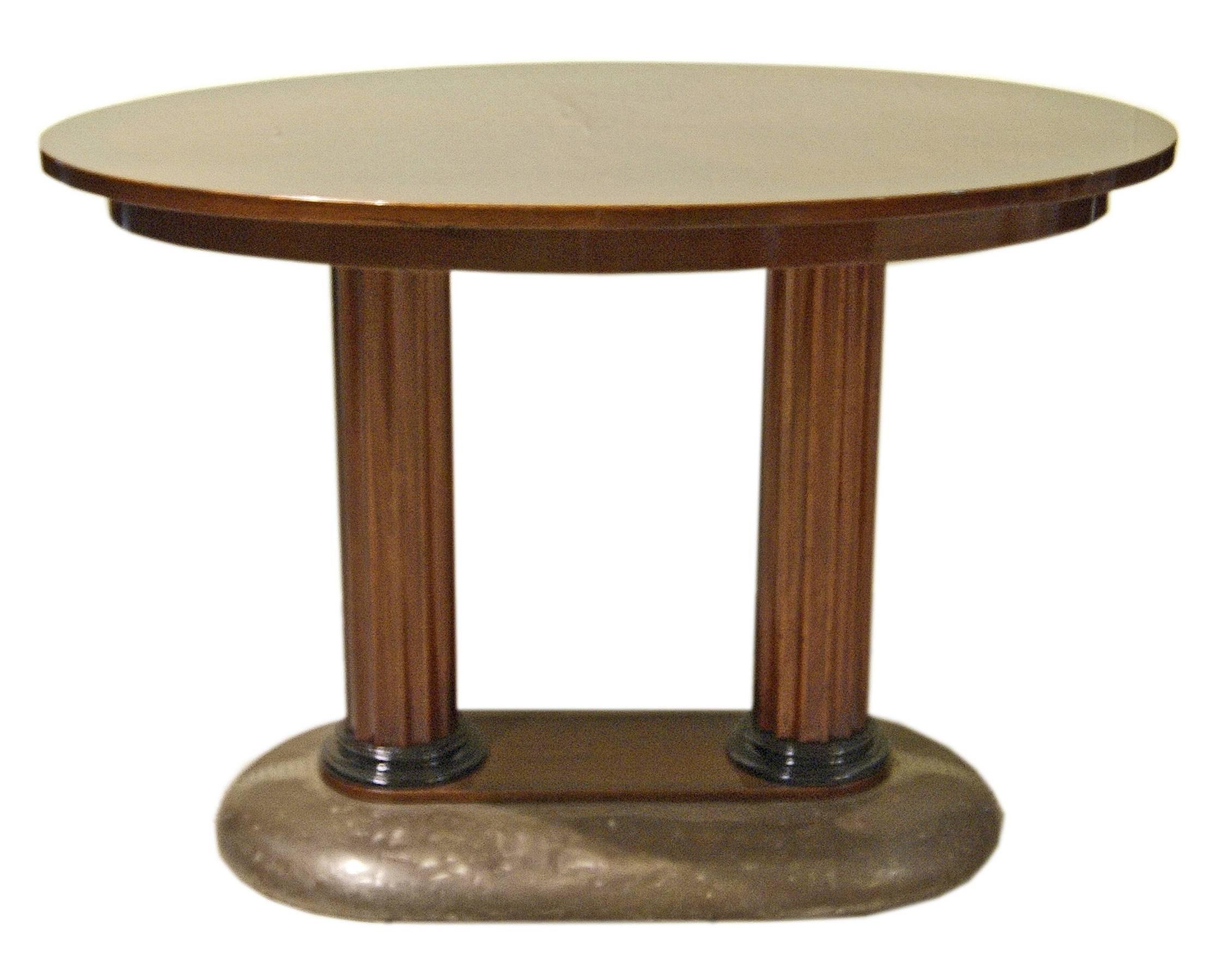 Art Nouveau table, made of mahogany wood: Mahogany massive and veneer (table's plate) / high quality handwork.
It is of most elegant appearance: The oval table's plate is attached to fluted pair of columns which is based on oblong support covered