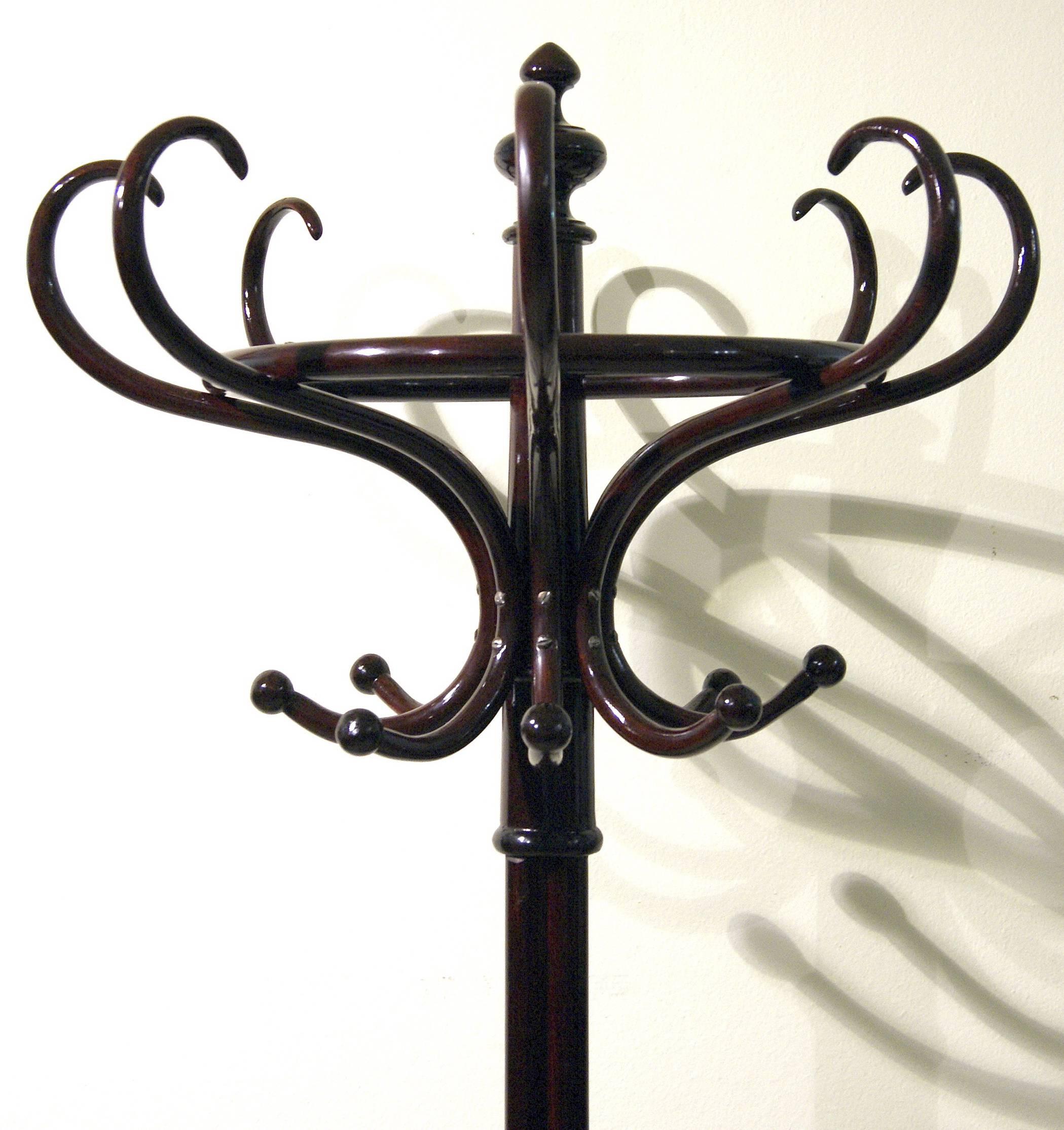 Thonet coat-tree / coat rack, model number 1 (authenticity guaranteed!)

Beechwood, dark mahogany stained / high quality handwork.
This Thonet coat-tree is of finest form type: It is accentuated by various 
circular as well as by helical