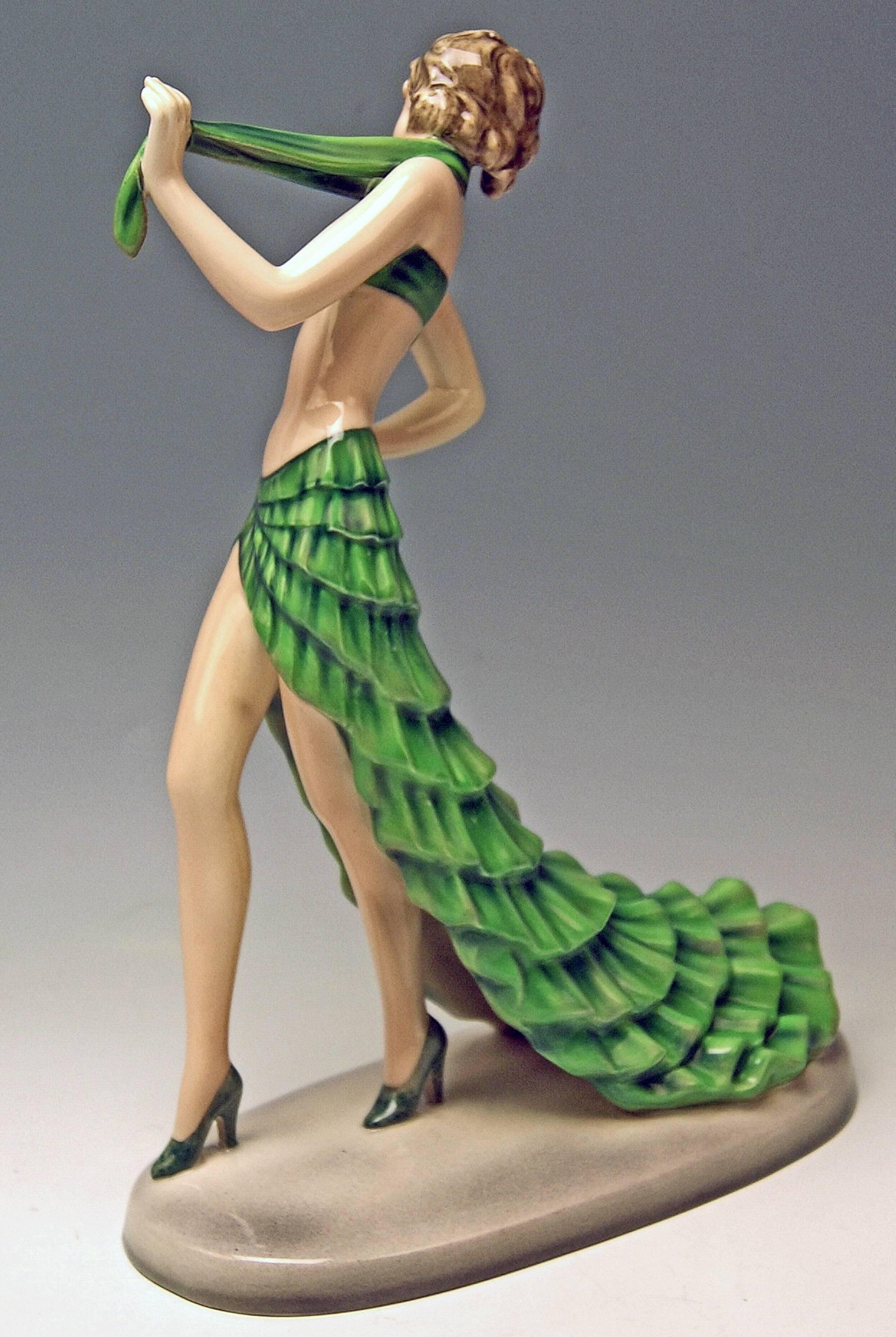 Goldscheider Vienna Lady Dancer Wearing Bikini And Long Skirt: It Is Called 'Rumba.'

Designed by Stefan (= Stephen) Dakon (1904-1992), modelled circa 1938. Made circa 1938. Model Number 8302 / 45 / 66.

Hallmarked:
Goldscheider WIEN (= VIENNA)