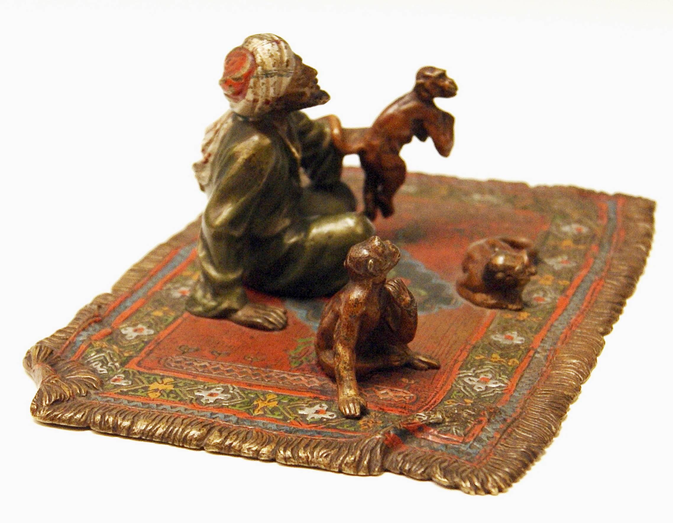 Gorgeous Vienna bronze figurine made by famous manufactory Bergman(n), circa 1900.
The Arab Man is playing with three monkeys: He sits cross-legged on a carpet, the man has seized one of the monkeys by right raised hand whereas the second monkey is