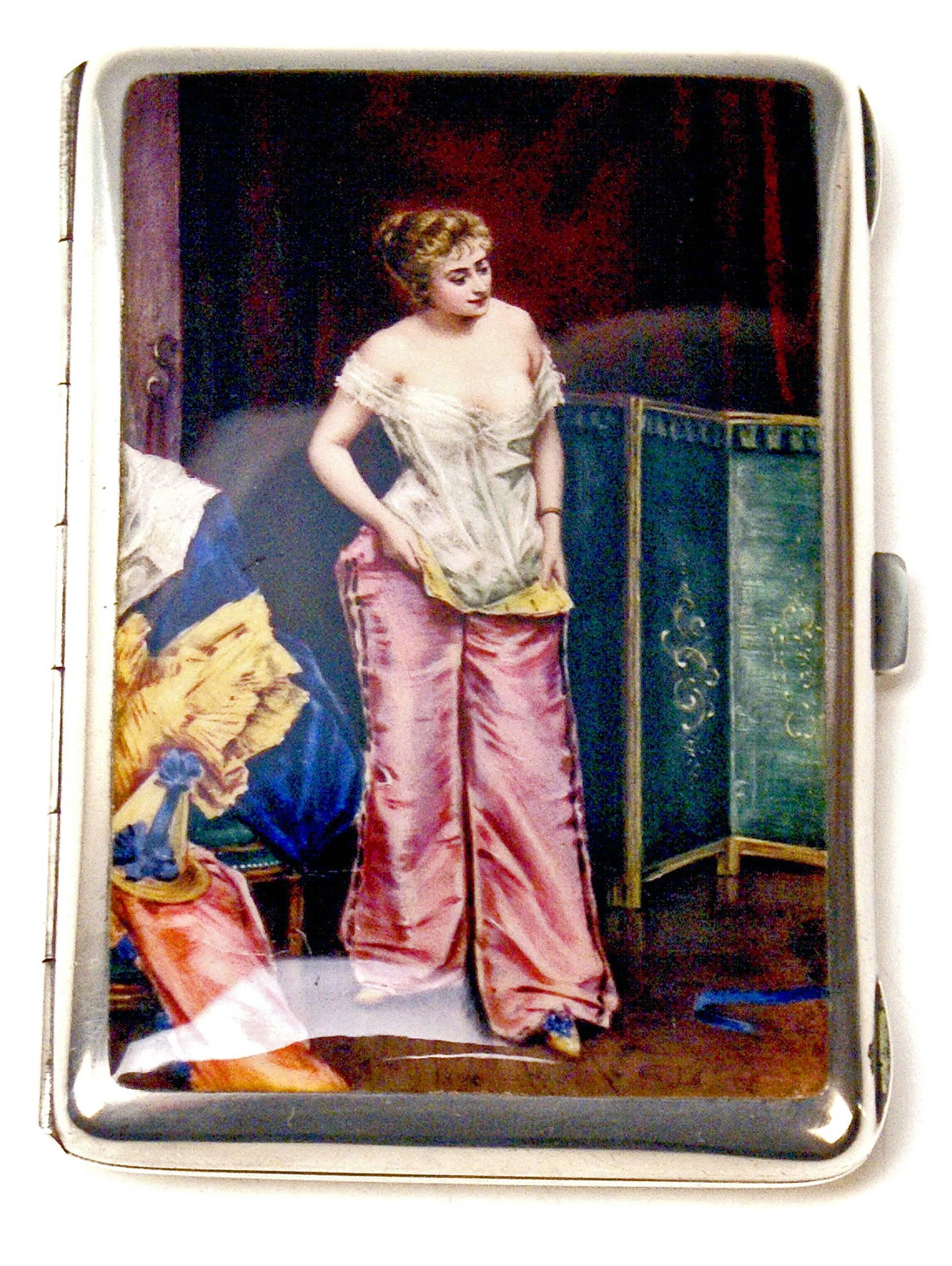 Very interesting silver 800 cigarette box / case with enamel painting covering lid: Lady in Boudoir, circa 1890.

The lid is decorated with stunning enamel picture - following scene is painted there: A noble lady being situated in her dressing