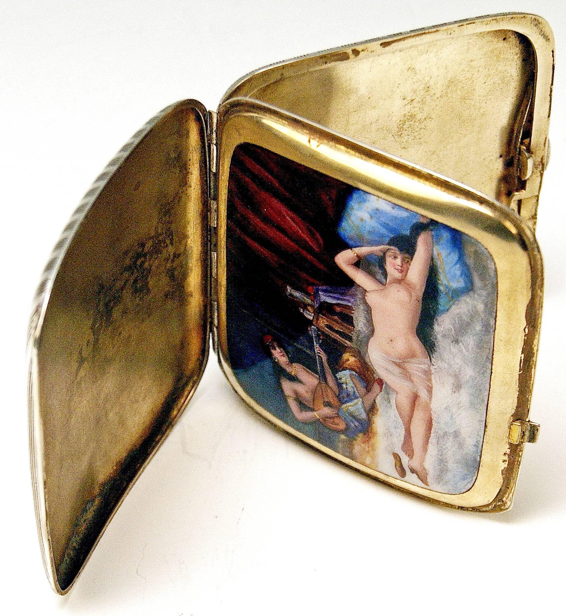 Very interesting silver 925 cigarette box / case with enamel painting covering inner lid: Odalisque lady nudes.

The inner lid is decorated with stunning enamel picture - following scene is painted there: Two oriental female nudes are visible here