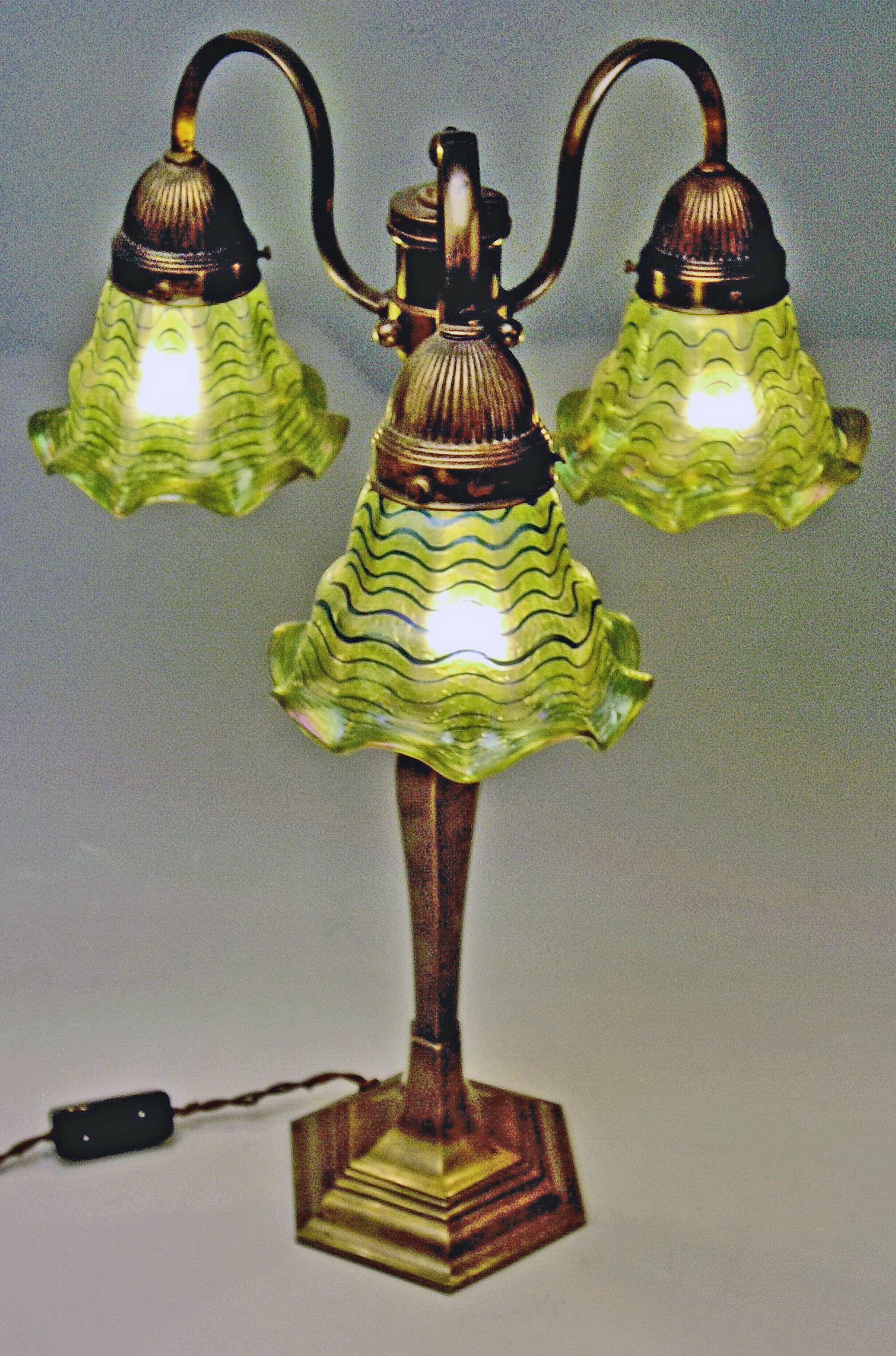 Stunning huge table lamp made of brass, with original glass lampshades.

Made by Pallme Koenig & Habel/glass manufactory Elisabeth* (Bohemia) / made circa 1920.
*Detailed information:
The brothers Josef and Theodor Pallme-Koenig founded together