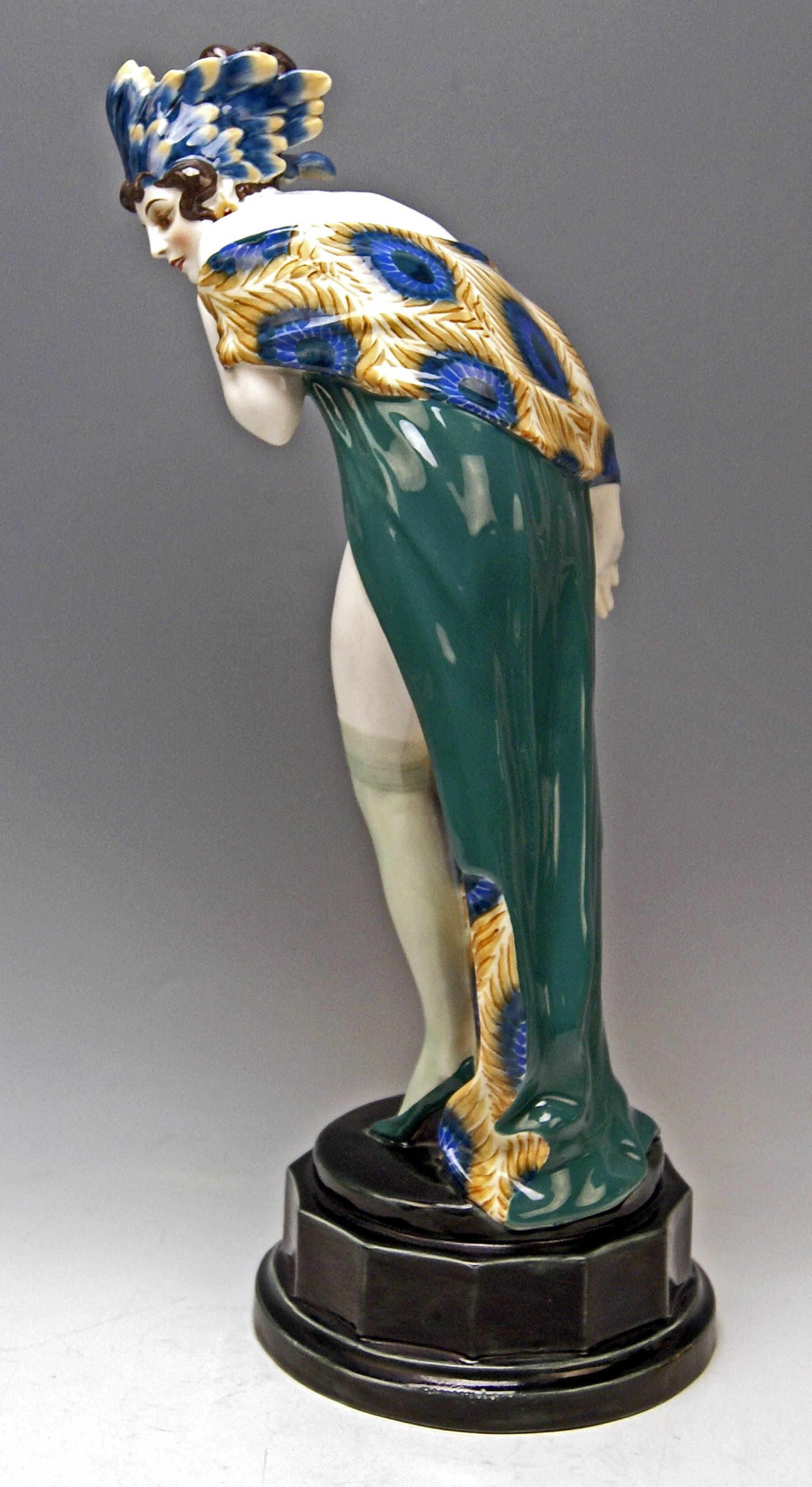 Goldscheider Vienna rarest lady nude figurine wearing feathered decoration, a very special type of cap, covering her head: It is called 'fascination.'

Designed by Wilhelm Thomasch (1893-1964), model created, circa 1922/made, circa 1925
model