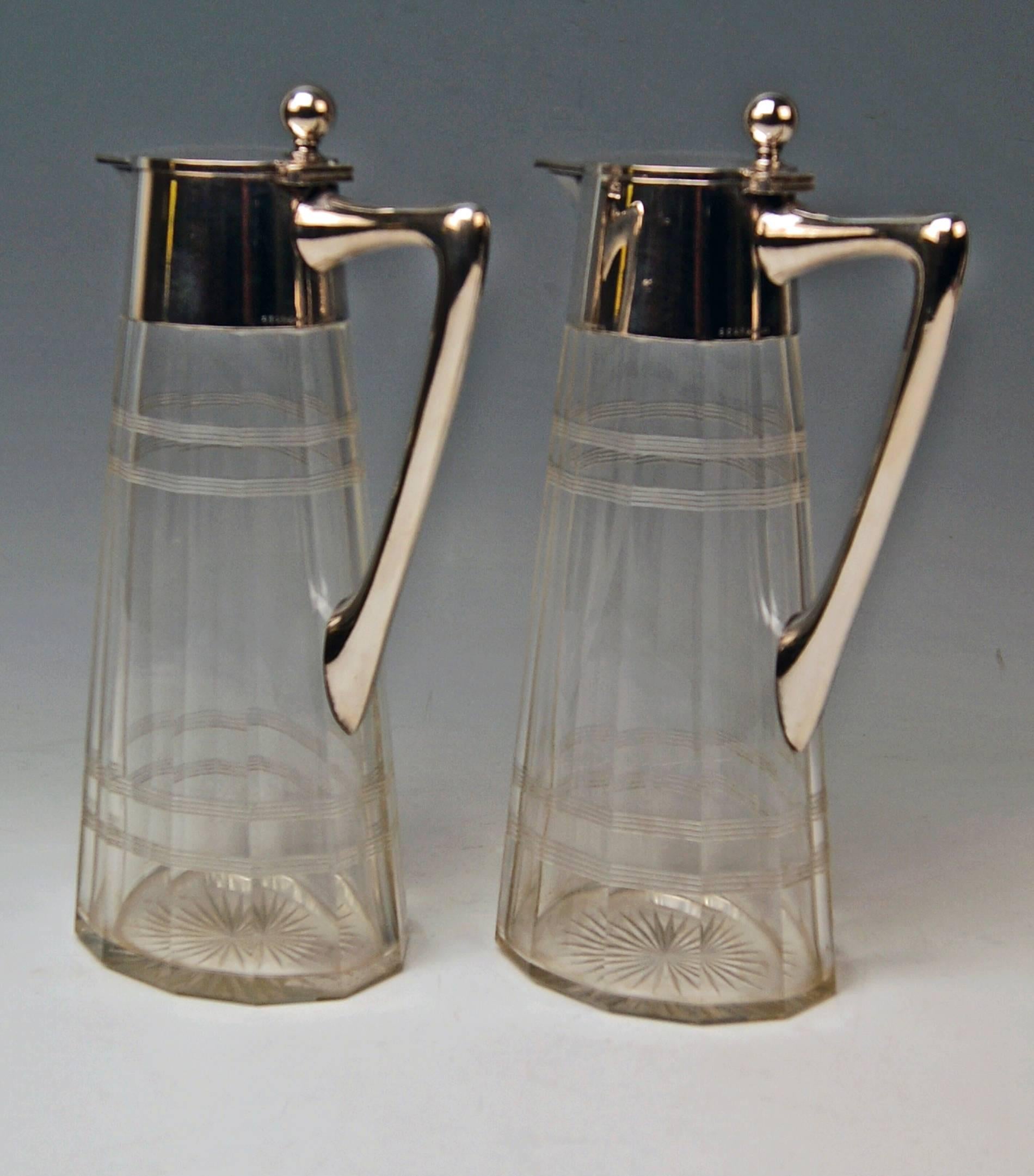 A pair of Art Nouveau glass decanters (Carafes) with silver mountings.
Hallmarked:
Mark WTB: Germany/Schwaebisch Gmuend, manufactory Wilhelm Binder, number 8329.
Silver 800.
German official silver stamp: Crescent with moon.

Made, circa