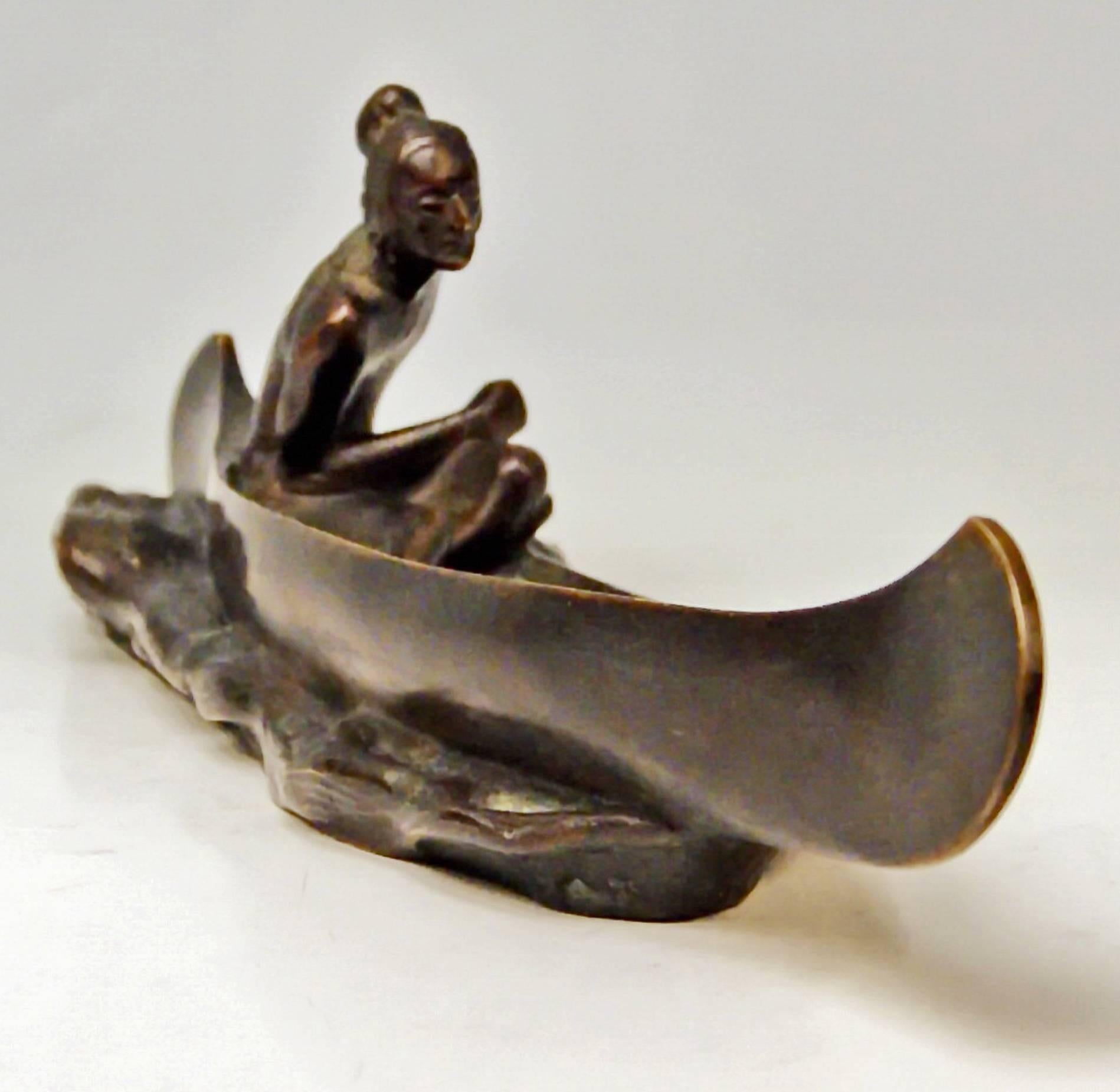 Gorgeous Vienna Bronze figurine created by famous bronze sculptor Carl Kauba (1865-1922) / made circa 1920. Style Native American.

There is aRed Indian having sat down in canoe boat visible, being busy with rowing: The man seems to make an effort