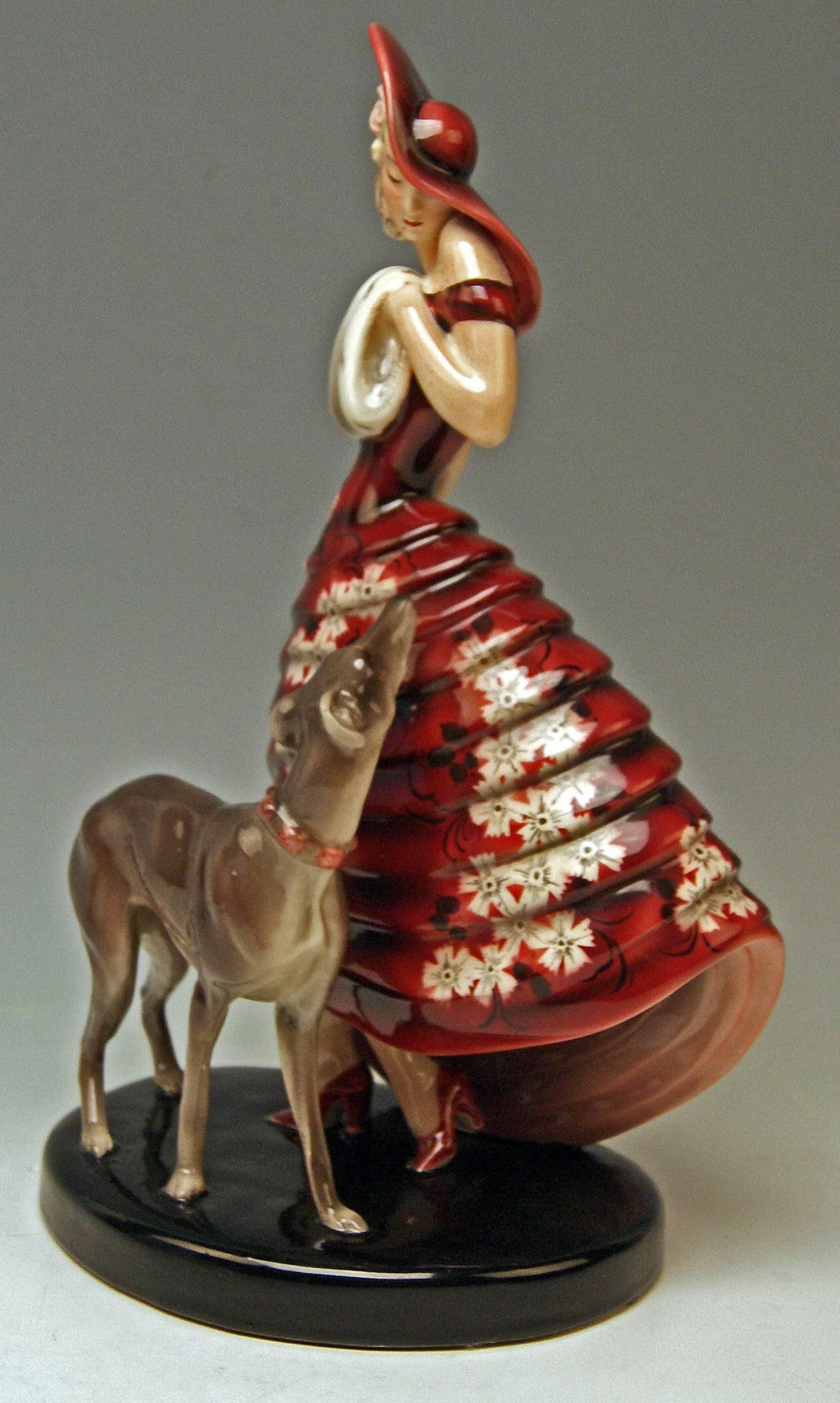 Goldscheider Vienna elegant lady with muff, accompanied by Greyhound.

Lady figurine designed by Klàra (Claire) Herczeg (Weiss) (1906-1997), 
model created circa 1930 / 31 (= this composition with dog was created a bit later - the dog was