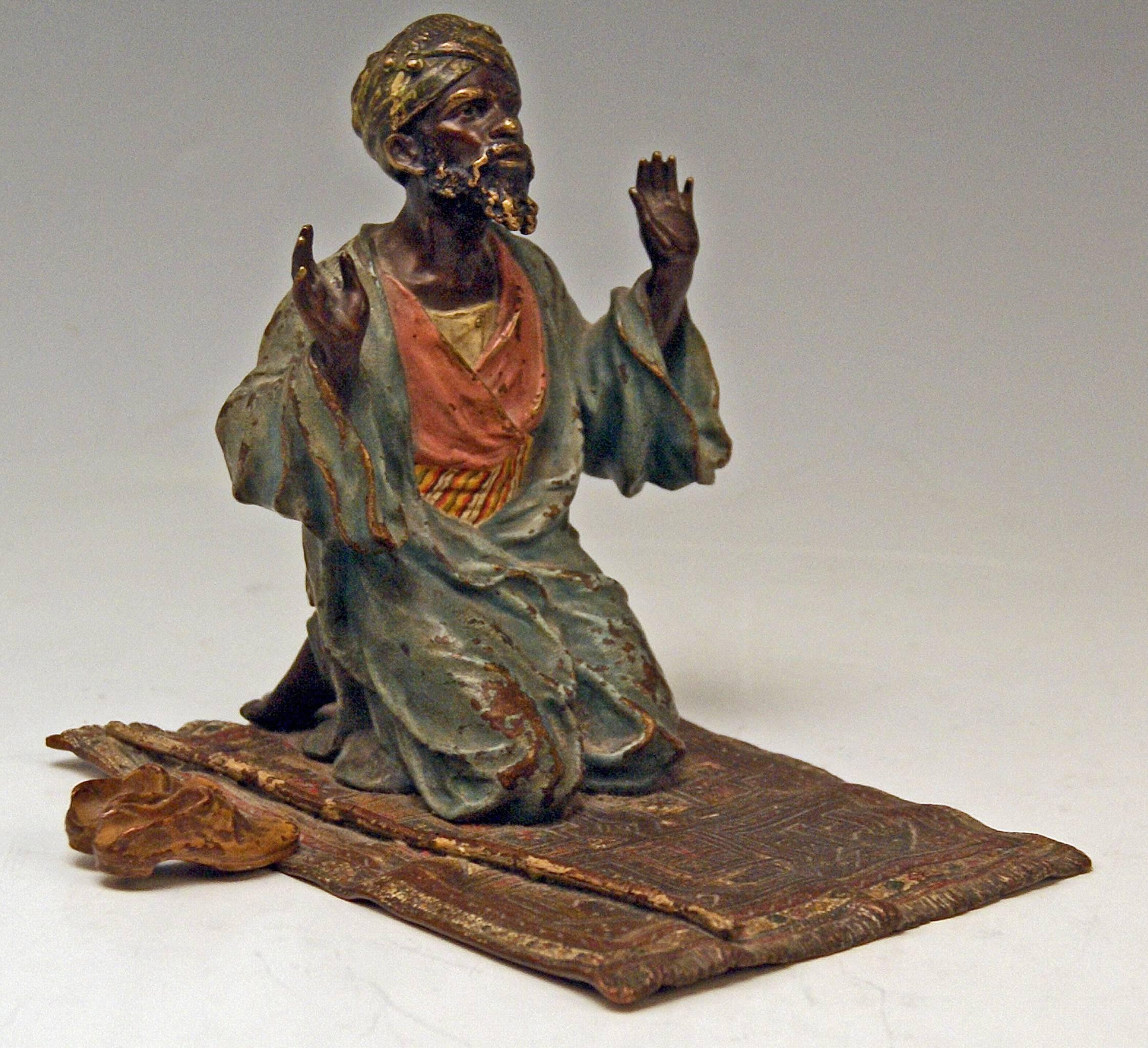Gorgeous Vienna tall bronze figurine made by famous manufactory Bergman(n), circa 1890-1900. 
The Arab man clad in oriental garments (= turban and girdled vest with mantel above it) is praying: He is kneeling on a carpet - the man raises his arms.