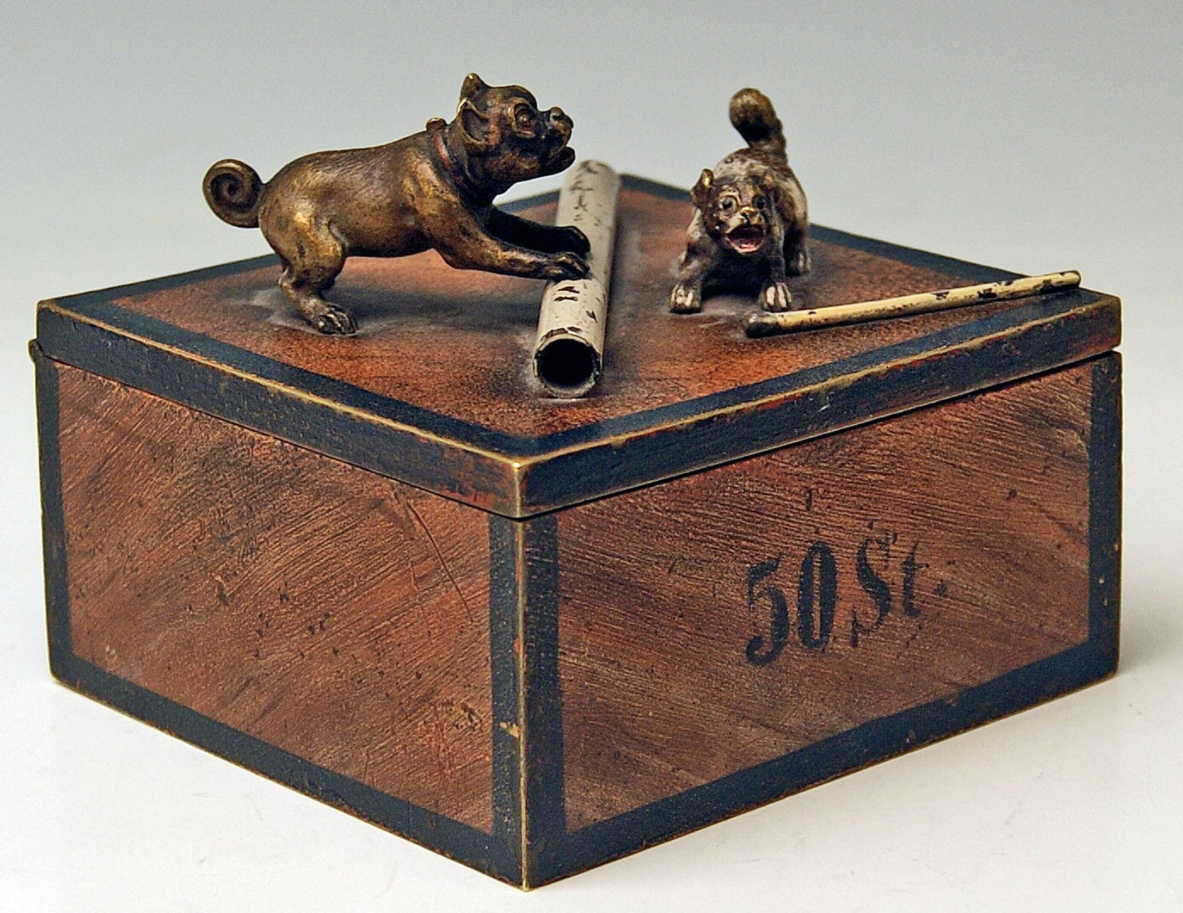 Gorgeous Vienna bronze tobacco box made by famous manufactory Bergman(n), circa 1890-1900.
The hinged lid of bronze box is decorated with most lovely sculptured dog figurines made of bronze, too - these are pugs playing with a roll as well as with