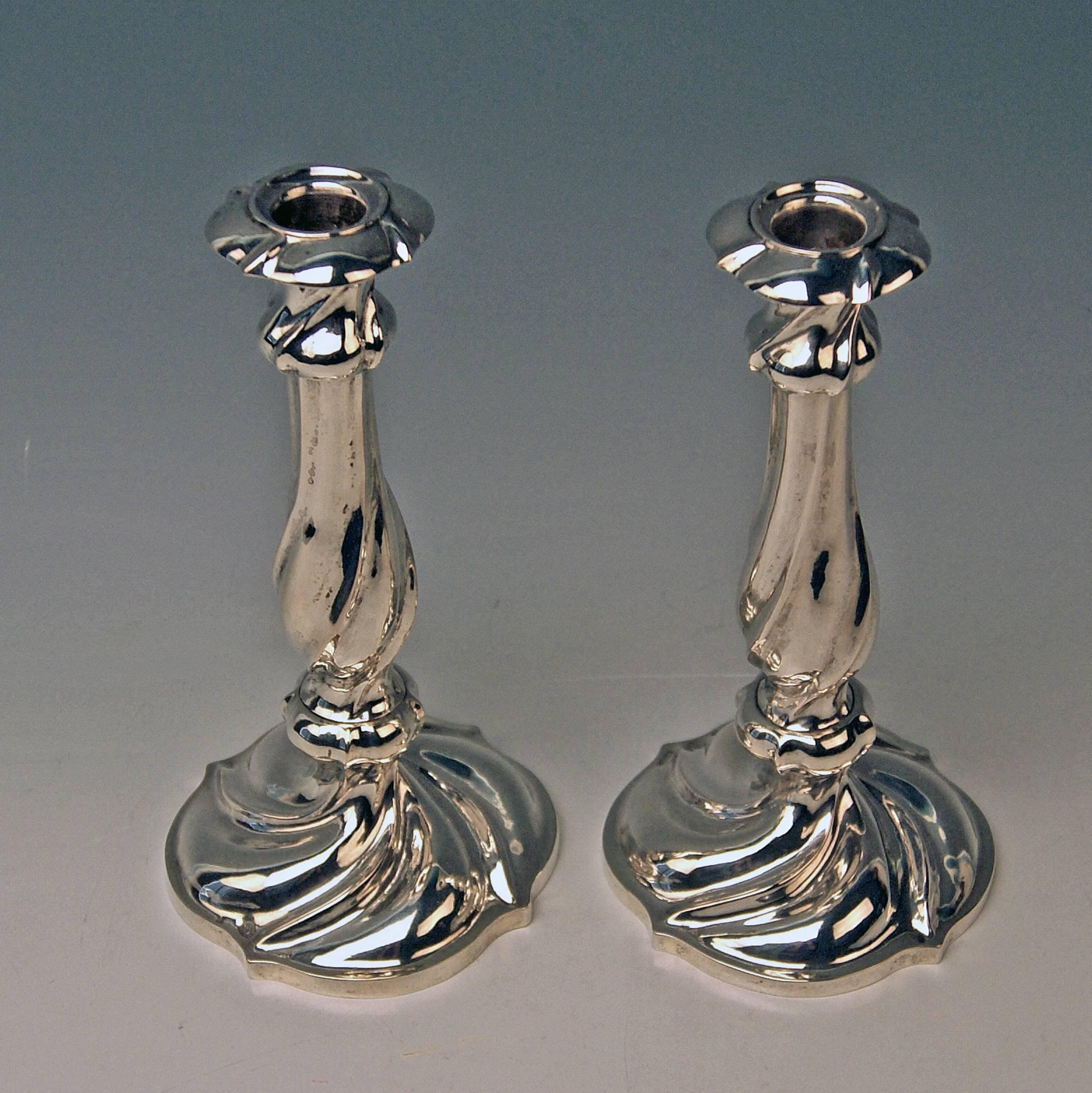 Austrian finest Biedermeier silver pair of candlesticks
made 1846  

Very interesting Viennese silver pair of candlesticks of excellent manufacturing quality as well as of elegant appearance: Each of these candlesticks has surface which is