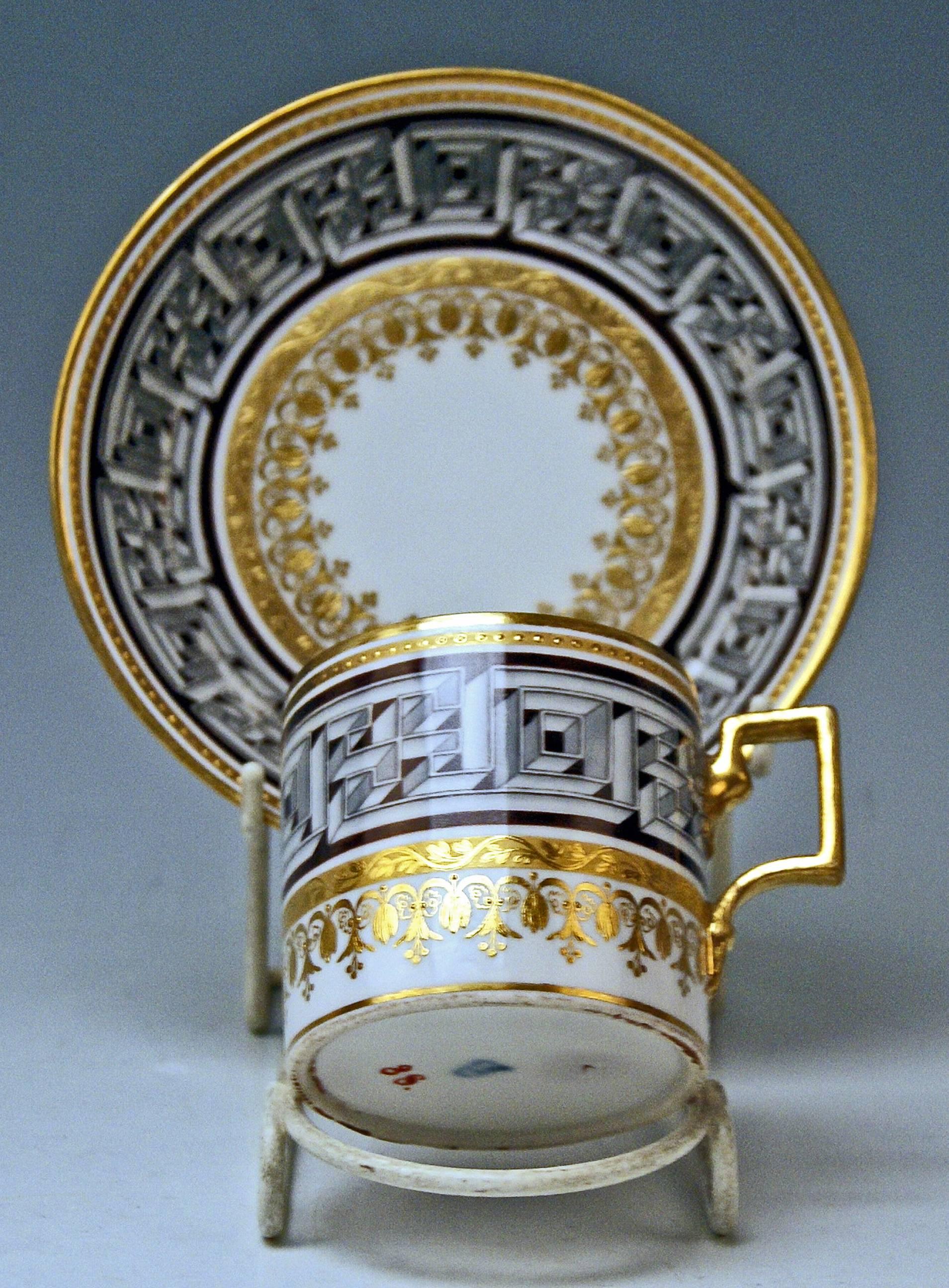 Cylindric cup with angular handle and saucer, both decorated with double meander ornaments.

Vienna / Old Imperial Austrian Porcelain Manufactory
(Alt Wien / Kaiserliche Porzellan Manufaktur)
dated 1800

Hallmarked:
FORMER's NUMBER