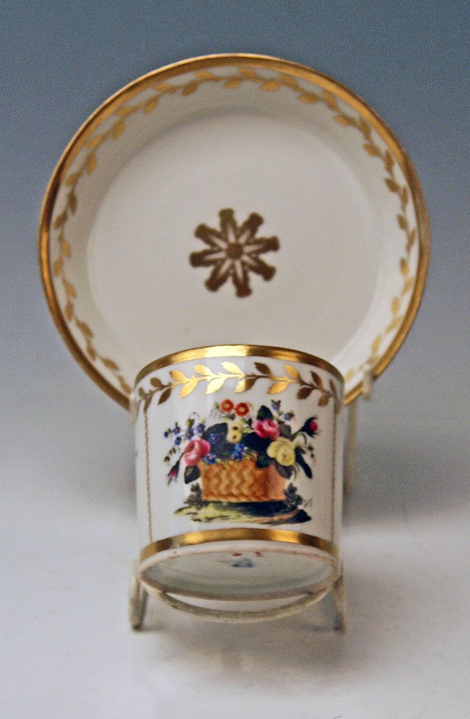 Cylindric cup with angular handle and saucer, both decorated with golden ornaments.

Vienna/ Old Imperial Austrian Porcelain Manufactory
(= Alt Wien / Kaiserliche Porzellan Manufaktur)
dated 1816

Hallmarked:
FORMER's NUMBER 40

VIENNESE