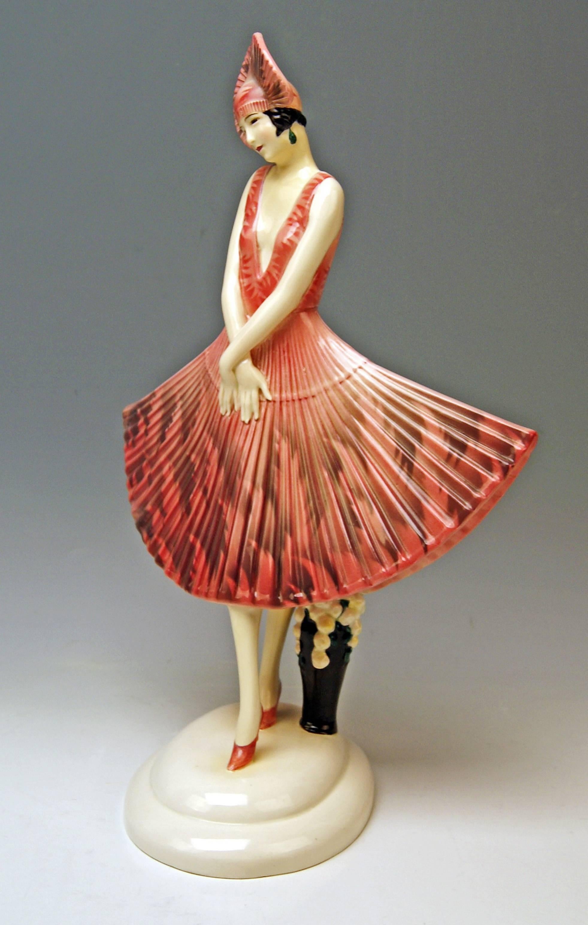 Goldscheider Vienna lady dancer wearing beautiful as well as rarely fan-shaped dress.

Designed by Stefan (= Stephen) Dakon (1904-1992), modelled, circa 1929 / made circa 1930. 
model number 5950 / 8 / 7

Hallmarked:
Goldscheider Wien ( =
