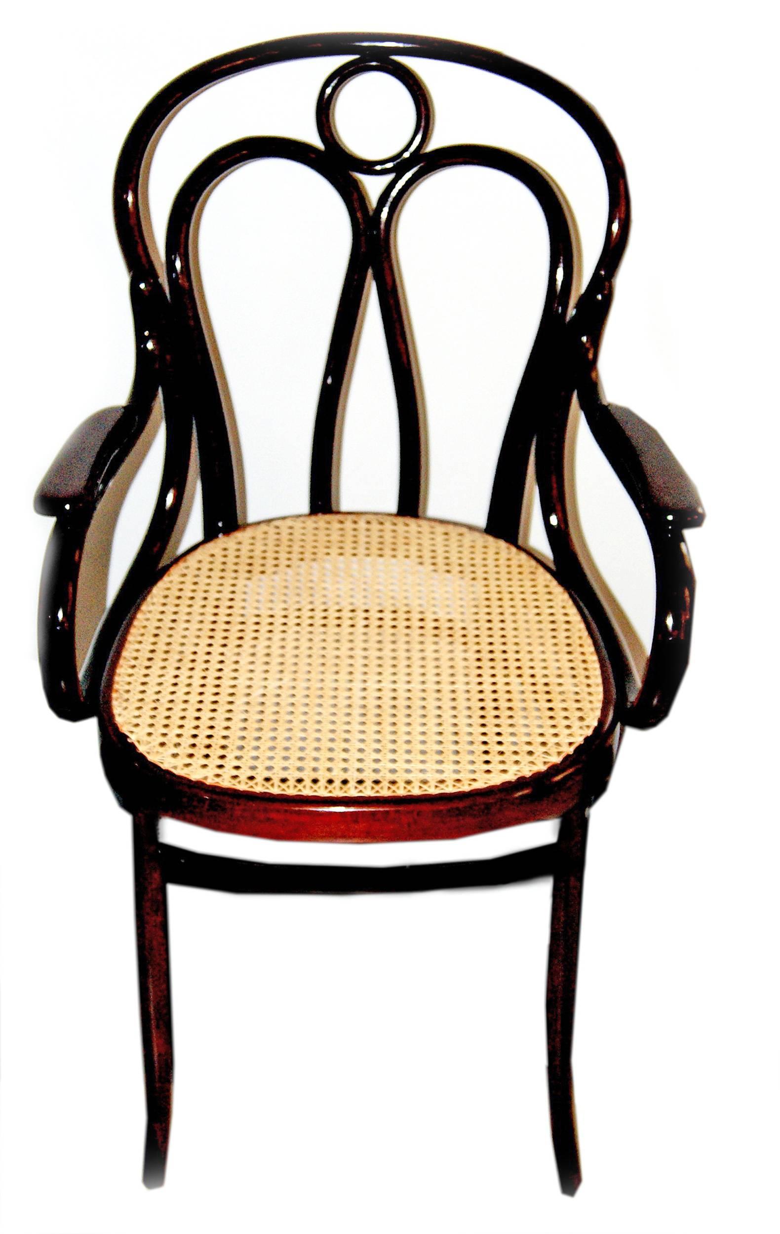 Jacob and Josef Kohn bentwood armchair (Model 36)
Made in Vienna / Austria, Art Nouveau period.
beechwood 
mahogany stained 
seat is covered with wickerwork (restored)
made, circa 1905

Bibliography:
J.& J. Kohn Catalogues 1904 & 1907