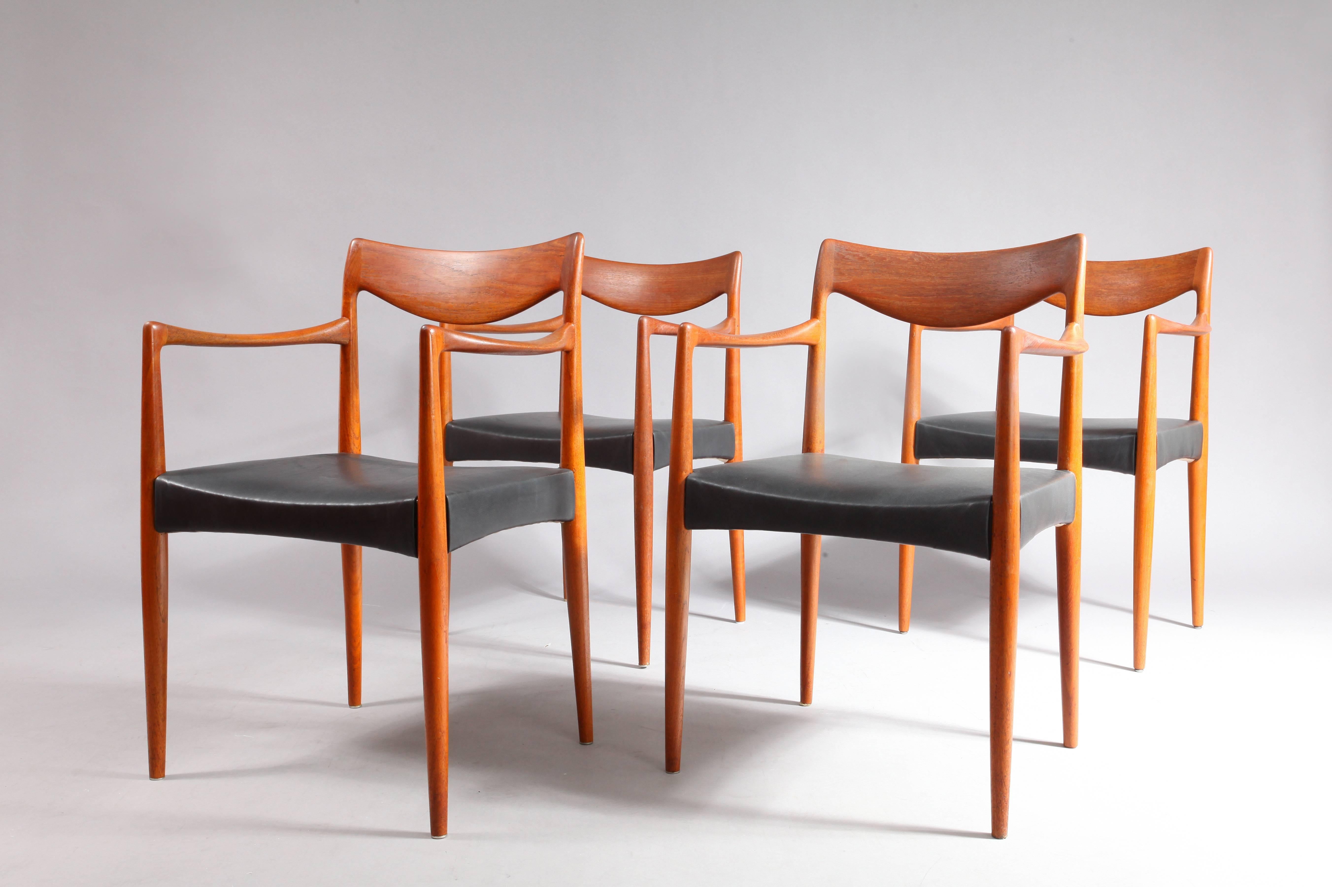 Four dining armchairs,
designed by Kai Lyngfeldt for Søren Willadsen,
Denmark, 1950.
Solid teak, black leather.
Measures: Height (80cm),
width (58cm),
depth (47cm),
seat height (18cm).