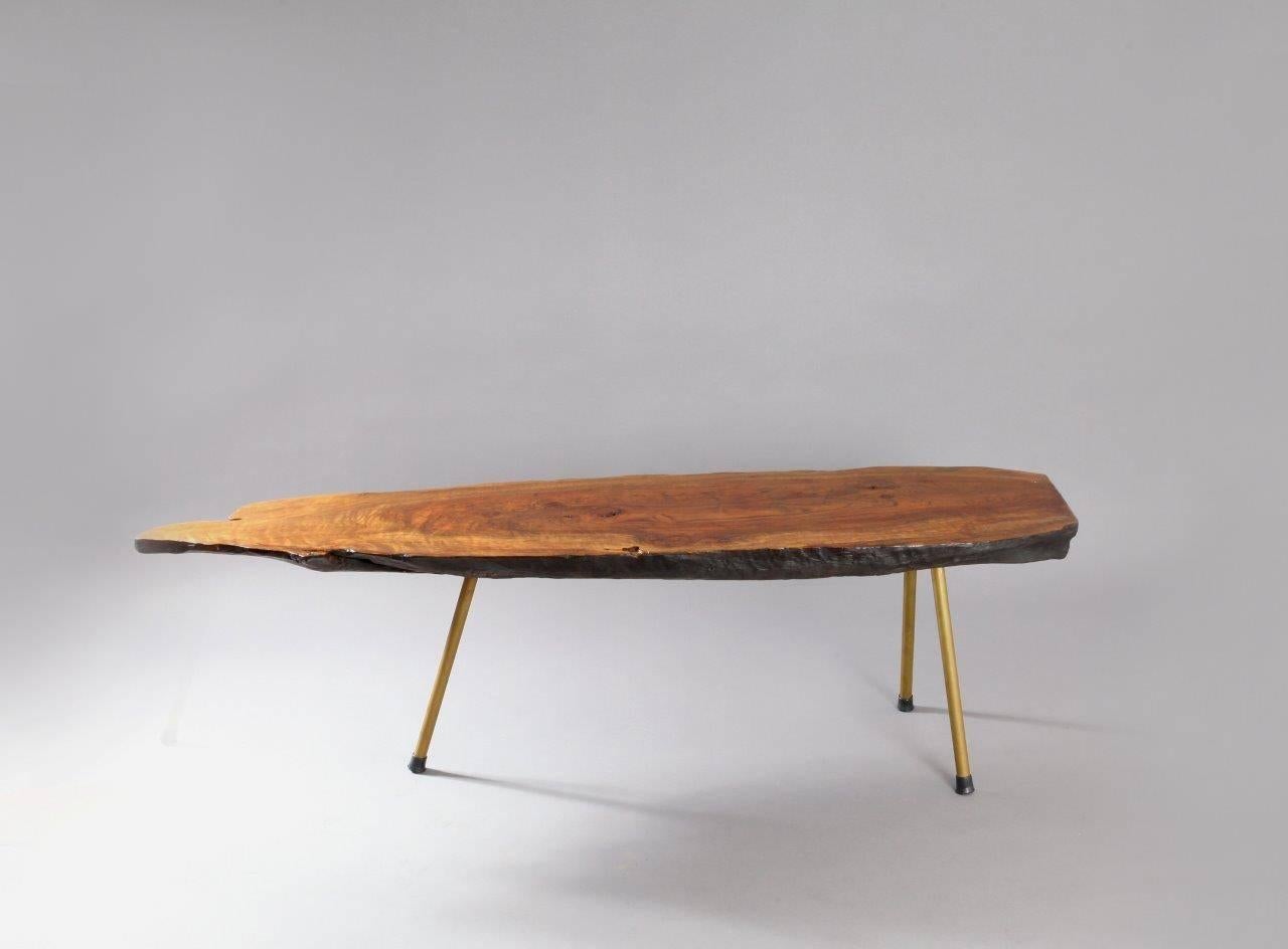 A beautiful huge Viennese tree trunk table, designed and executed by Carl Auböck in the 1950s. Made of a walnut wood slab, black/darkbrown painted bottom, with three brass legs and rubber shoes.