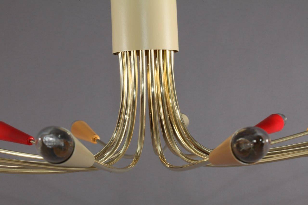 Huge Italian Sputnik,
Italy, 1950,
18 brass arms with coloreful cones.
18 bulb sockets E 14 max. 40 watt.