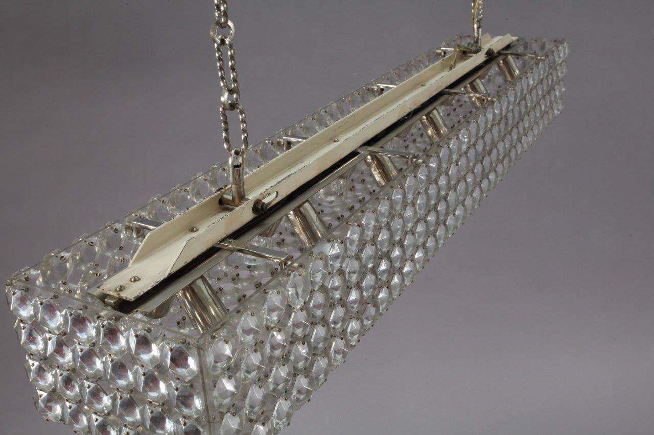Big rectangular modernist chandelier on two nickel-plated chains executed by Modernist Bakalowits Vienna, Austria in the 1970s. Fully covered with beautiful crystals on a white painted and nickel-plated hardware. Professionally restored, 12 bulb