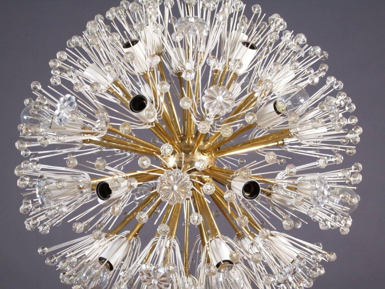 Charming 1950s light brass fixture by Emil Stejnar for Nikoll with copious amounts of Austrian crystals, rewired for US J-boxes, overall height can be adjusted, max. wattage 25 W per socket, 16 E14 bulb sockets.
Vienna, 1950.
The length of the stem