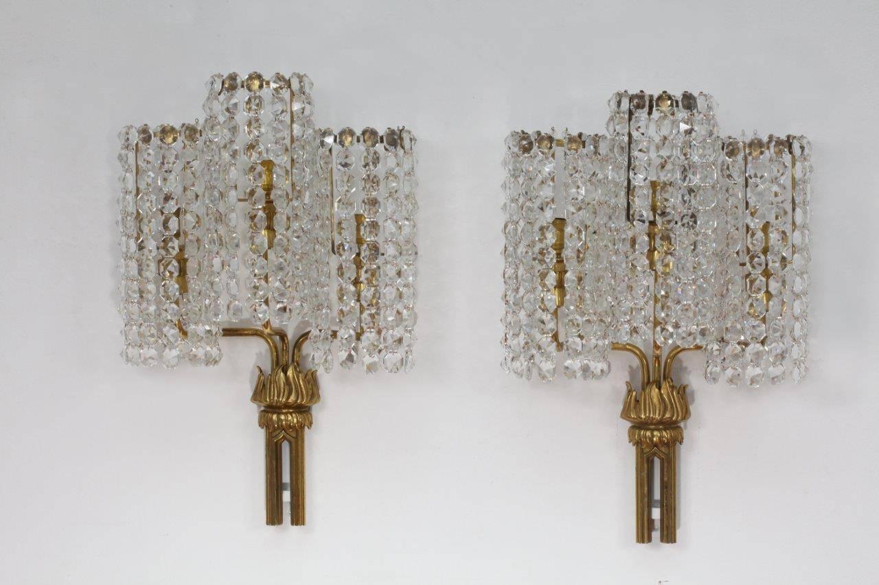 Pair of wall sconces,
Bakalowits, Vienna, 1950.
Hand-cut-glass stones.
Brass.
Three bulb sockets E14 each max 60 watt.